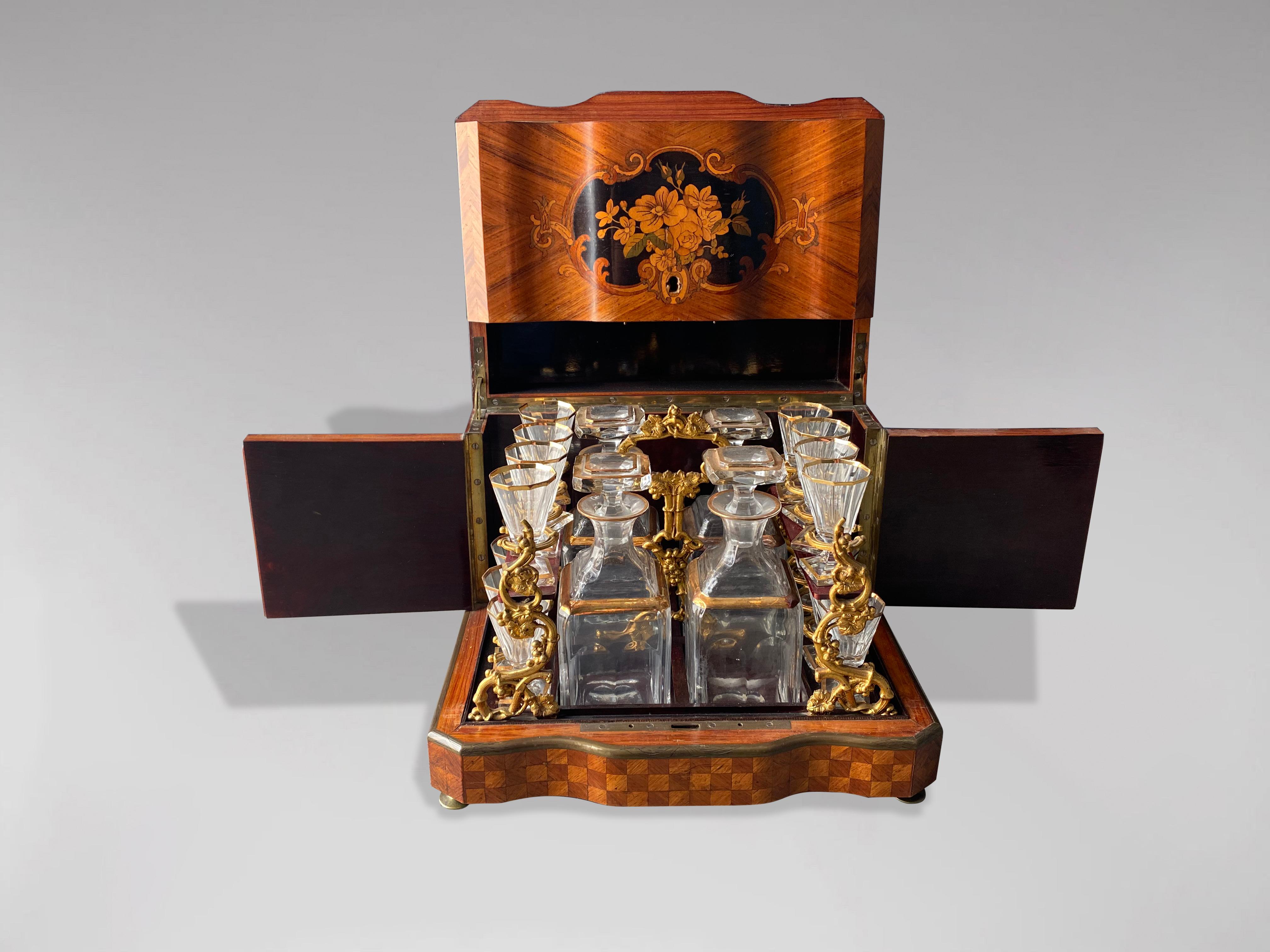 A Mid-19th Century Napoleon III period twenty piece French liquor cellar with Baccarat crystal attributed partial gilt glass barware, Paris, France, mid 19th century. The magnificent classical French Cave à Liqueur Set is of the finest master
