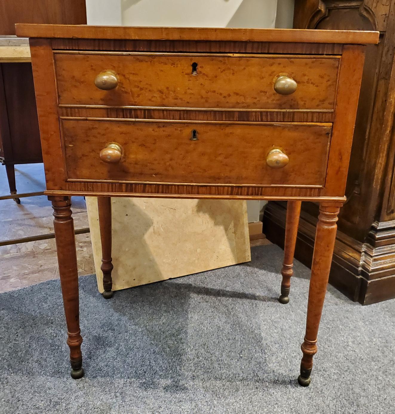 Early 19th century New England side table. Made of beautiful Birdseye Maple with two drawers and delicate turned legs. Great color and patination and good proportions. United States, circa 1840.
Measures: 28” H 22” W 16” D.