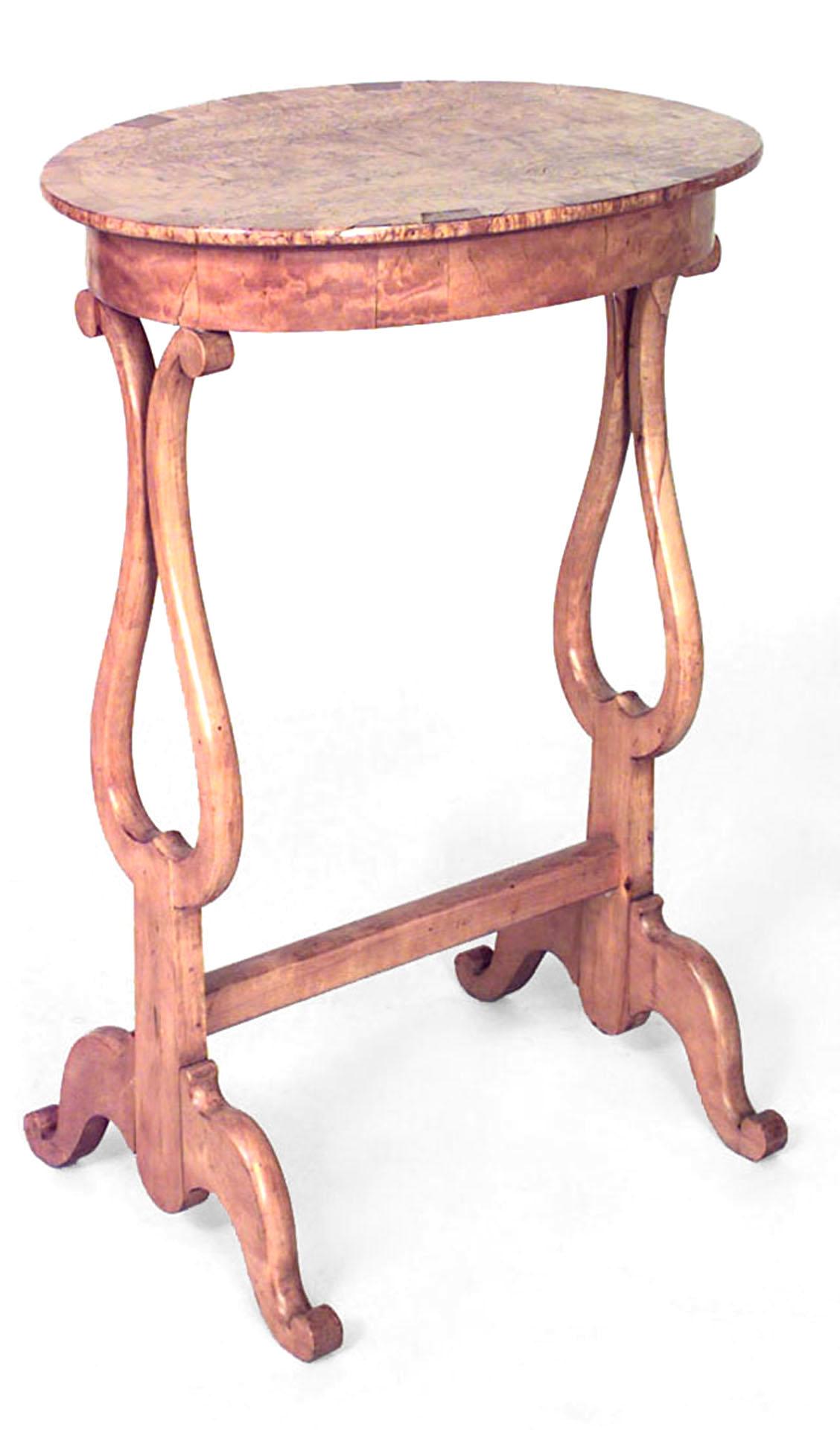 North European Biedermeier (Possibly Russian, Mid-19th Century) Karelian birch & fruitwood side table with oval top on lyre form legs joined by a stretcher.
