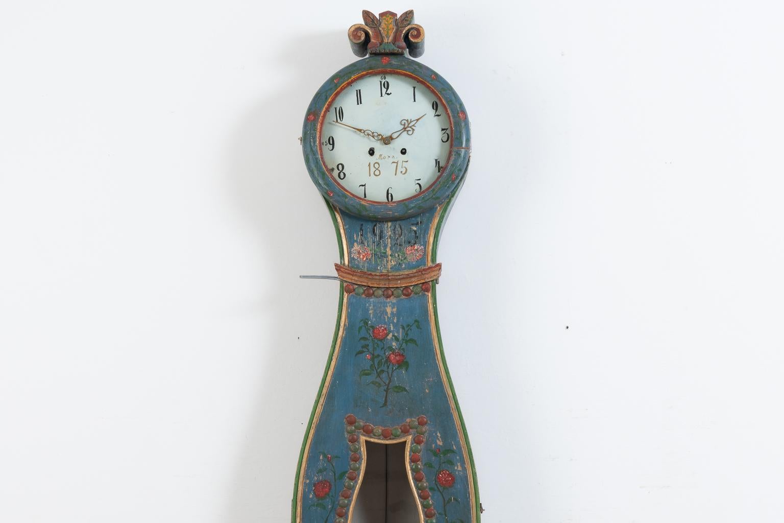 Northern Swedish long case clock. Manufactured during the mid-19th century from Swedish pine. The clock was renovated and repainted in 1925. The clock comes with the original clockwork, two iron weights and pendulum. The clockwork is not serviced