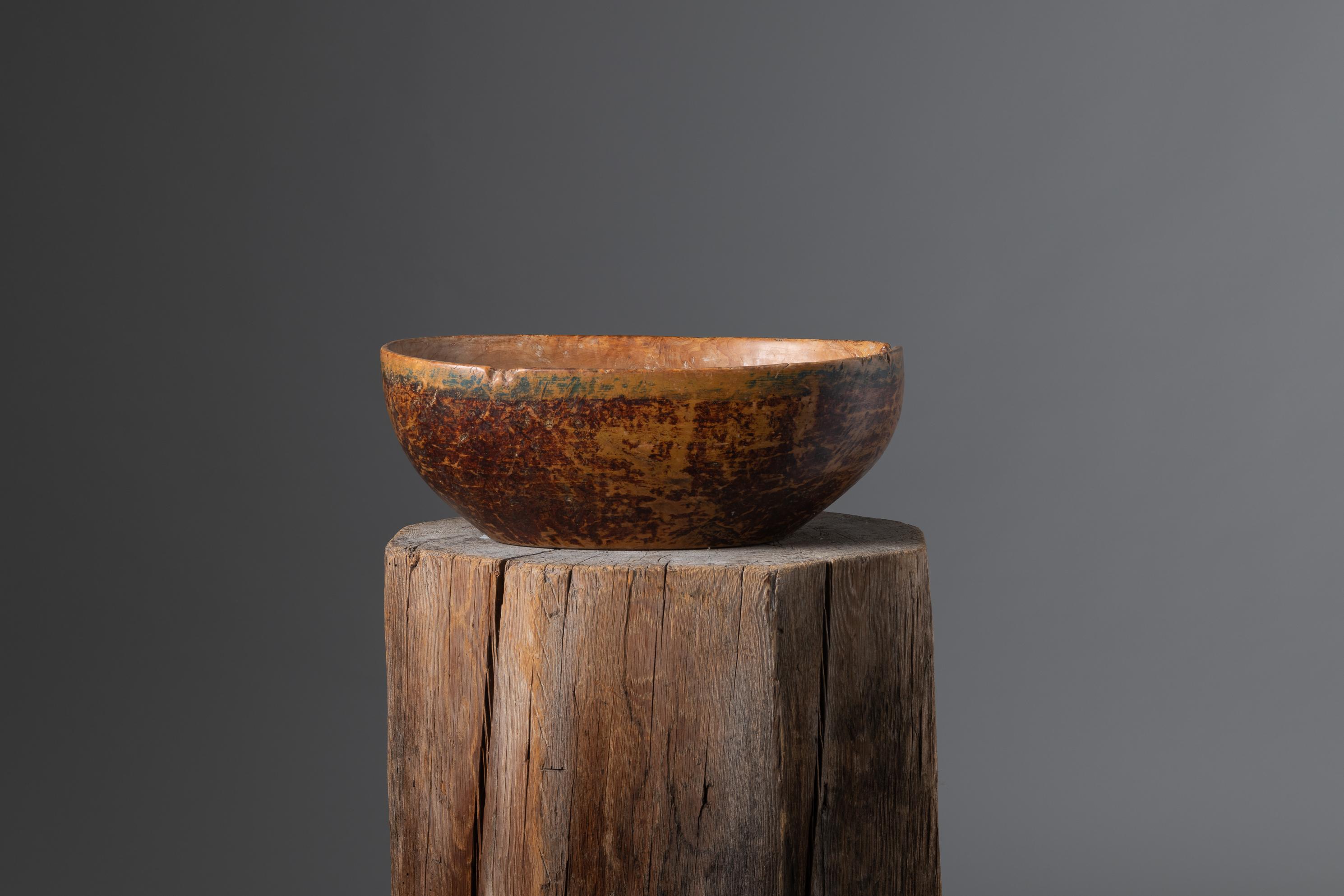 Northern Swedish mid-19th century wood bowl. The bowl has an organic or oval shape and unusually high sides which makes it unusually deep. It has some marks of use on the outside but the bowl still has the original faux paint. Bowls like these were