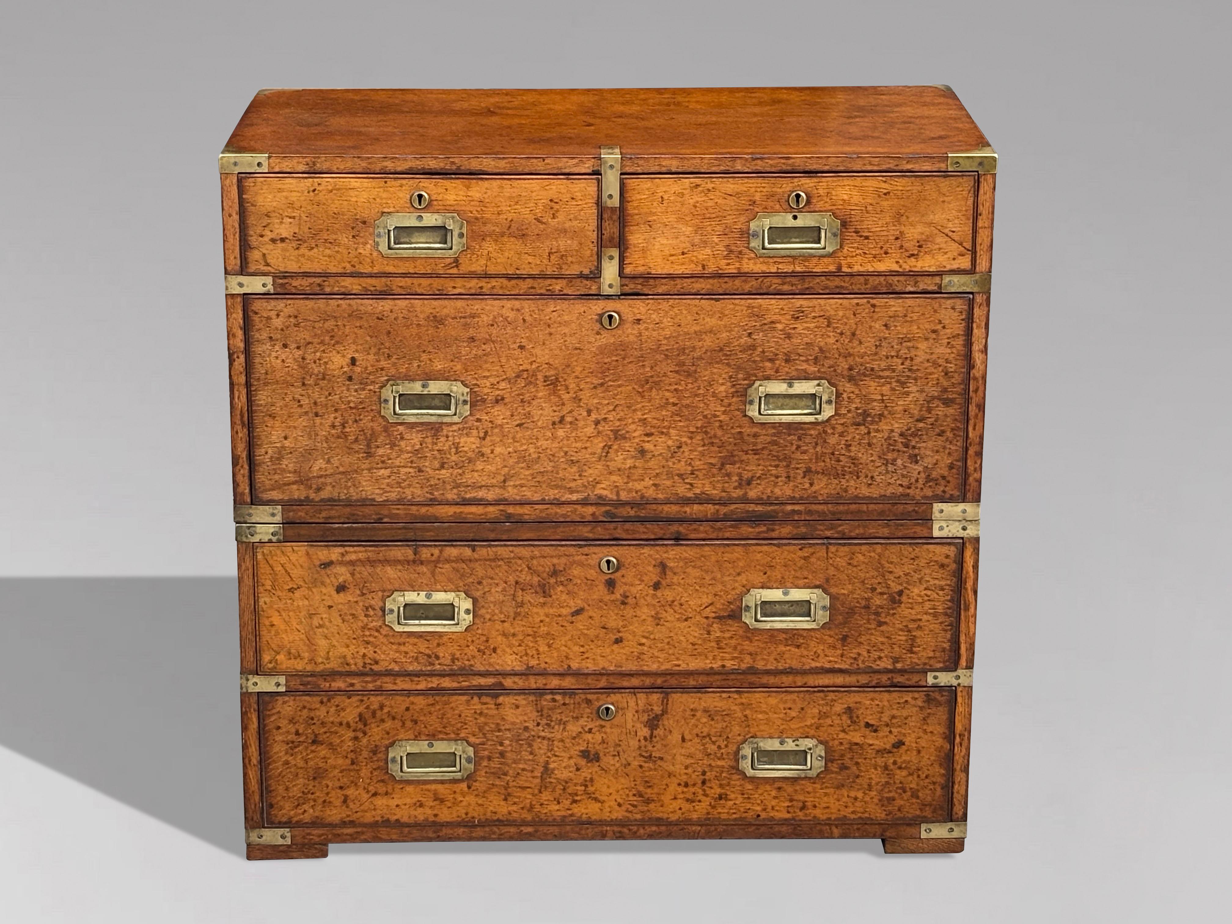 A Handsome 19th Century Oak British Military Officer's Campaign Chest of Drawers

This striking mid-19th-century oak campaign chest of drawers exudes the timeless elegance and functionality typical of British military furniture. Crafted around 1840,