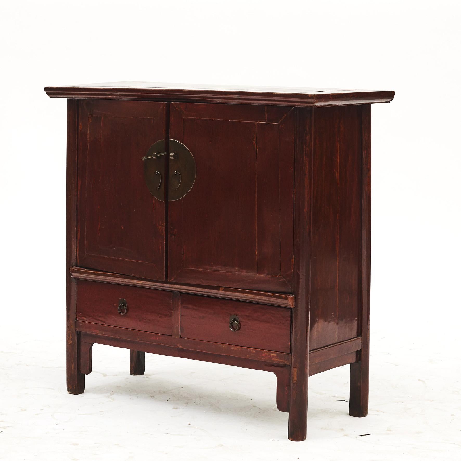 Chinese cabinet in original red lacquer with two drawers over double door.
This Qing cabinet has a lovely natural aged patina with a lacquered finish giving the paint incredible depth.
From Shanxi Province, China, 1840-1860.