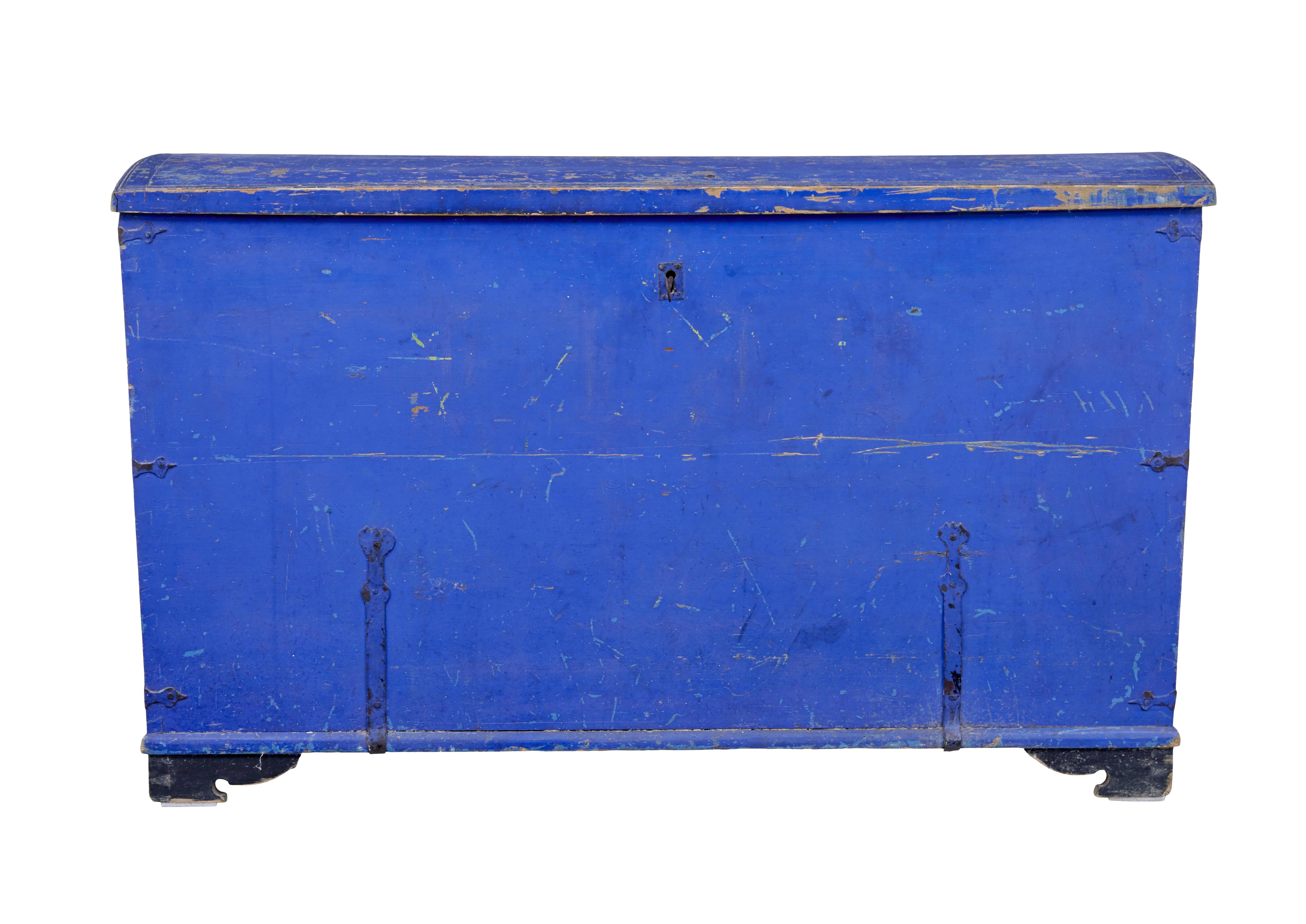Rustic swedish painted pine blanket box circa 1866.

Signed with a name inside the lid and a date of 1866.  Painted in a period vivid blue colour and black painted bracket feet.

Metal handles to each side, with metal decorative strap work. 