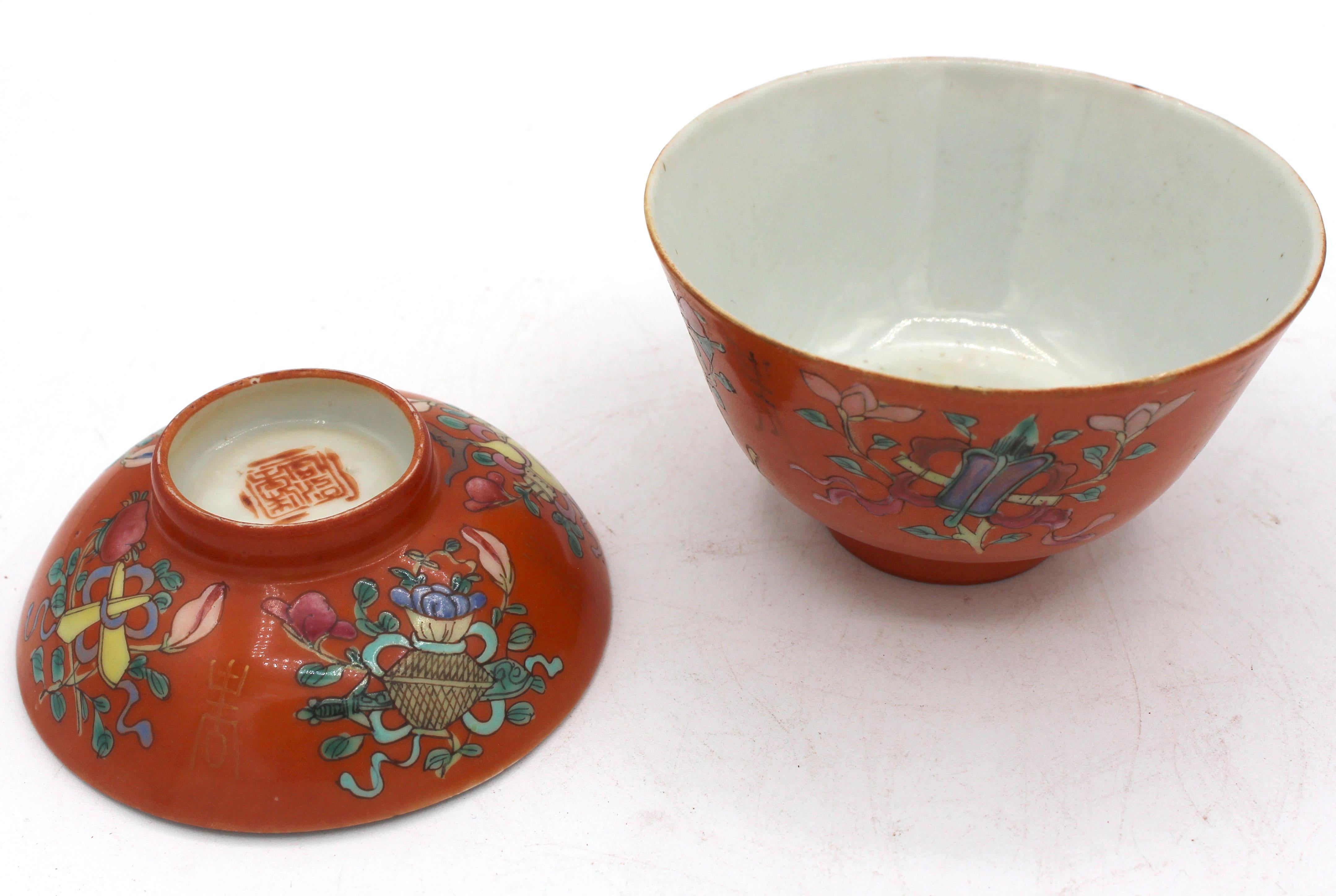 Mid-19th century pair of coral ground covered bowls, Chinese. Qing dynasty. Rare coral ground with auspicious symbols & gilt character marks. Gilding rubbed & one rim chip (with fun packing label note from Mayflower Warehousemen's Association).
4