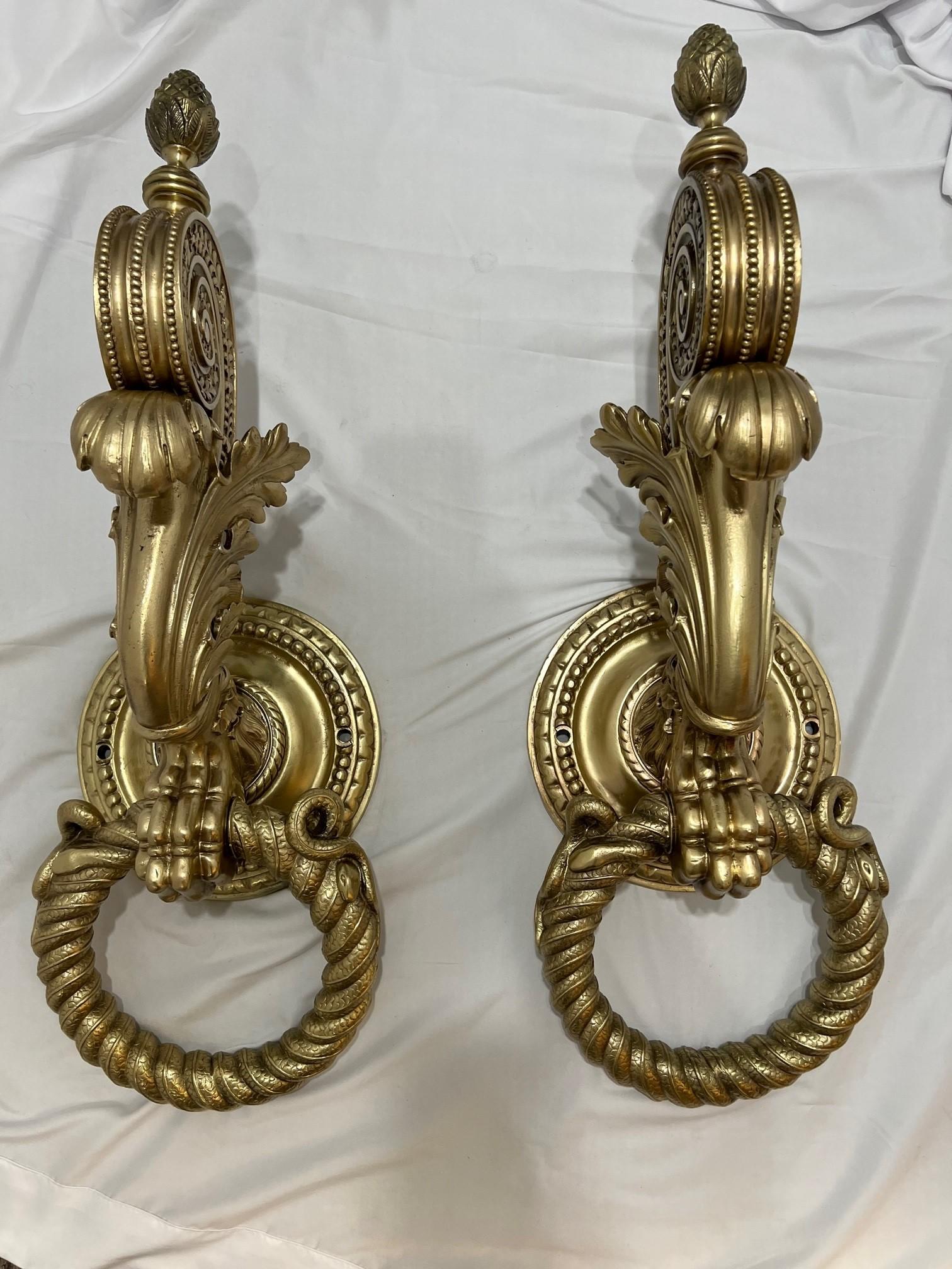 Mid to late 19th century monumental antique architectural pair of bronze door knockers, the largest I have even seen. This amazing pair of door knockers with its beautiful and intricate detailing have been professionally polished back to its