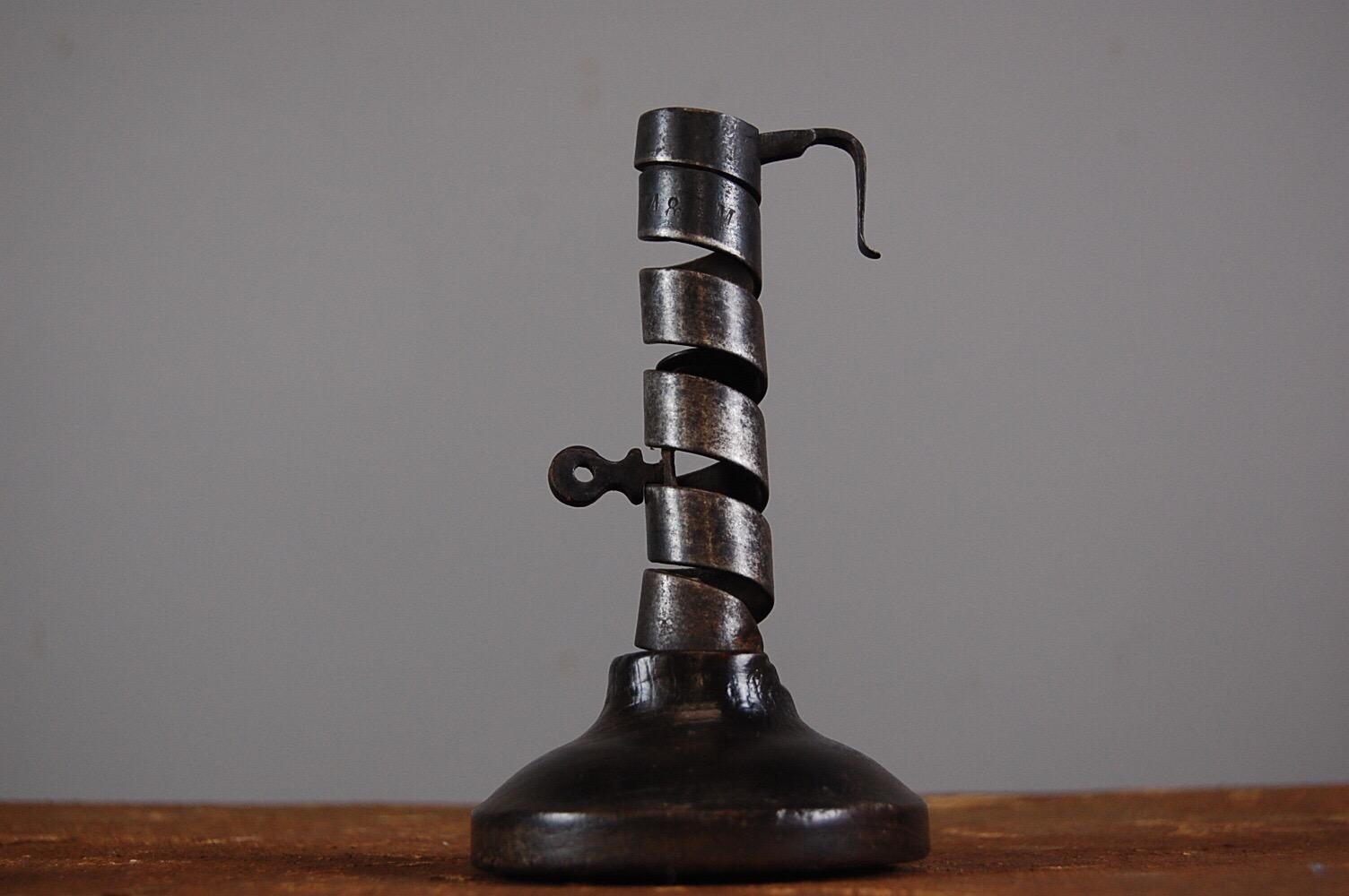 Wonderful pair of wonky spiral Rat du Cave candle holders, used in the wine cellars or caves of France, Sculptural and decorative but perfectly usable too. Priced for the pair. 

Measurement for larger. Dimensions: 9cm x 18cm x 9cm.
