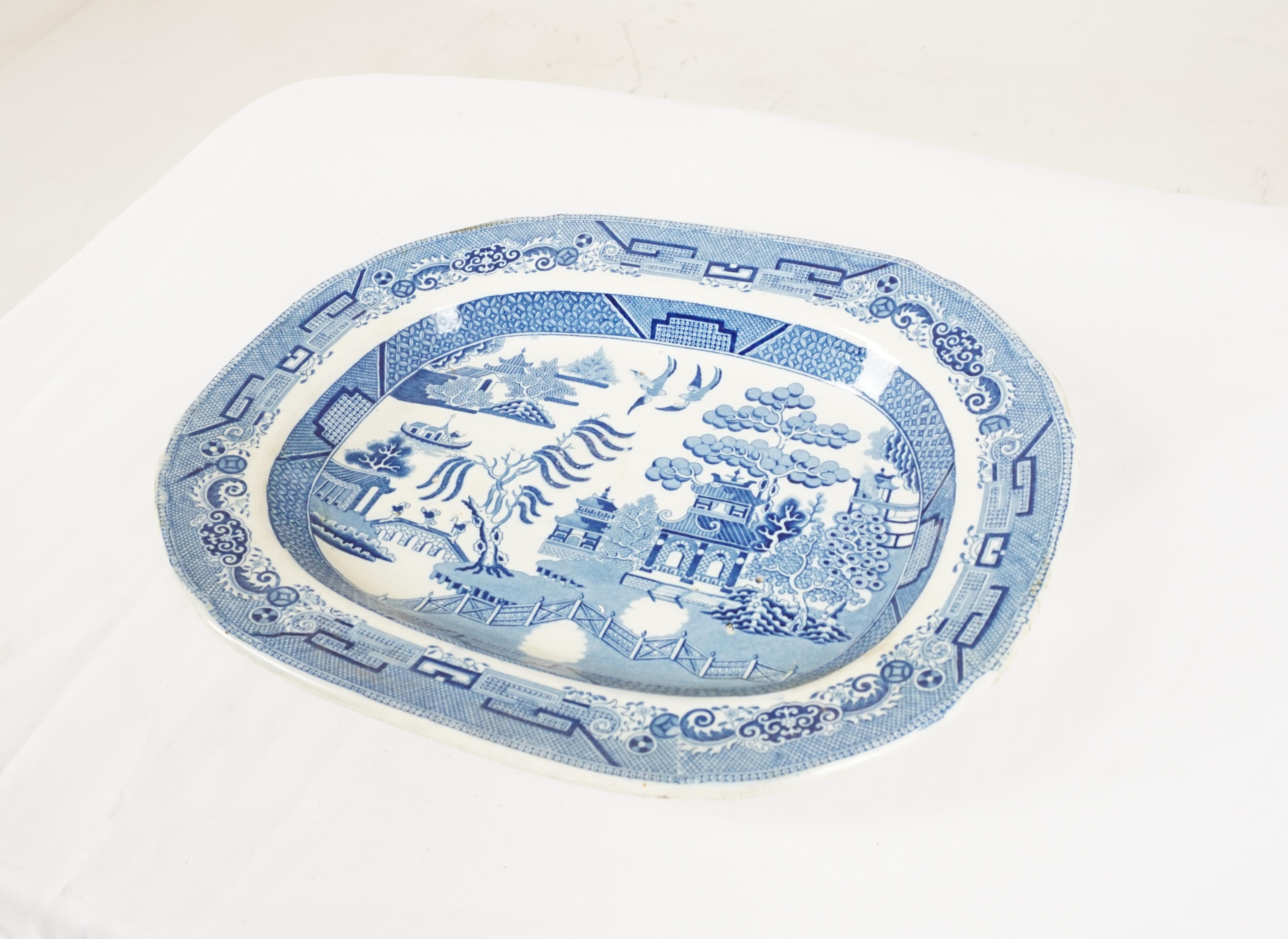 Mid 19th century pearlware blue willow transfer platter, England 1840, H631

England 1890
Tree has well shaped impression into the body and has a blue and white pattern
Has a blue and white willow pattern
