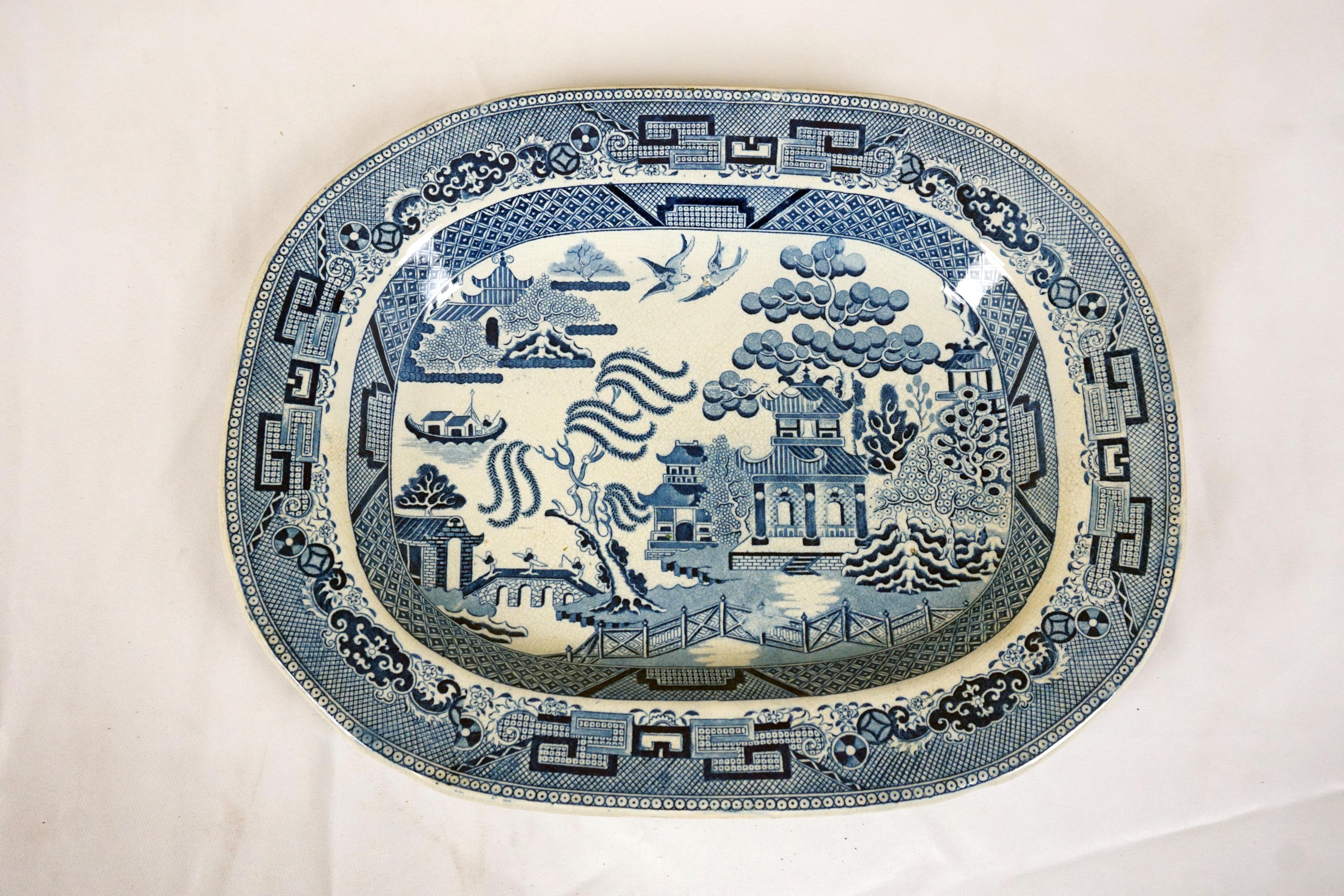Mid 19th Century Pearlware Blue Willow Transfer platter, England 1840, H632

England 1890
Tree Has Well Shaped Impression Into The Body And Has A Blue And White Pattern 
Has A Blue And White Willow Pattern
