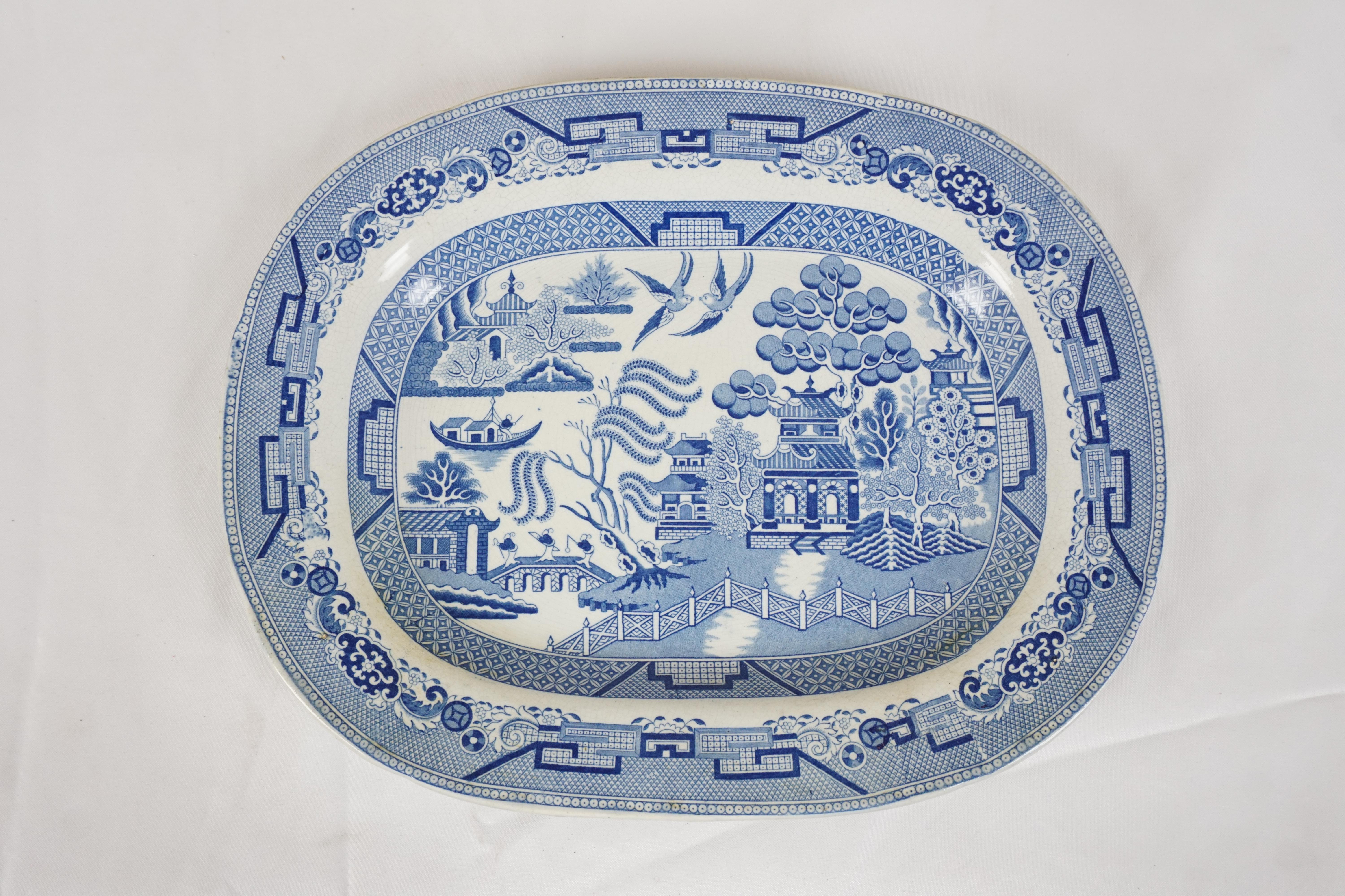 Mid 19th Century Pearlware Blue Willow Transfer platter, England 1840, H629

England 1890
Tree has well shaped impression into the body and has a blue and white pattern
Vivid colors
Marked on the underside
Very faint crack