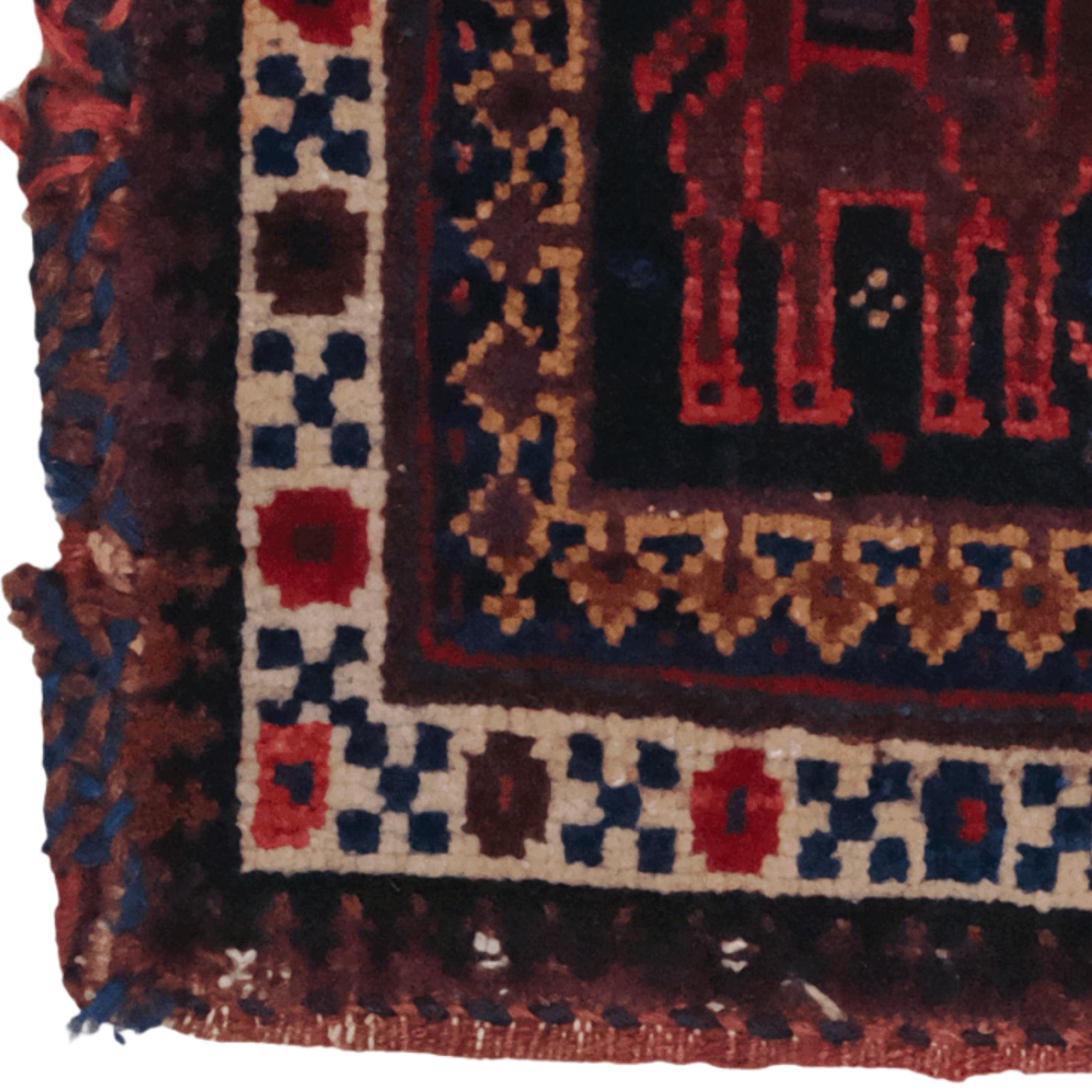 This antique Persian bag is a rare work of art, hand-woven in Iran in the mid-19th century. The carpet's unique motif and color composition reflect the finest intricacies of Persian carpet weaving.

The animal figures at its center create a striking