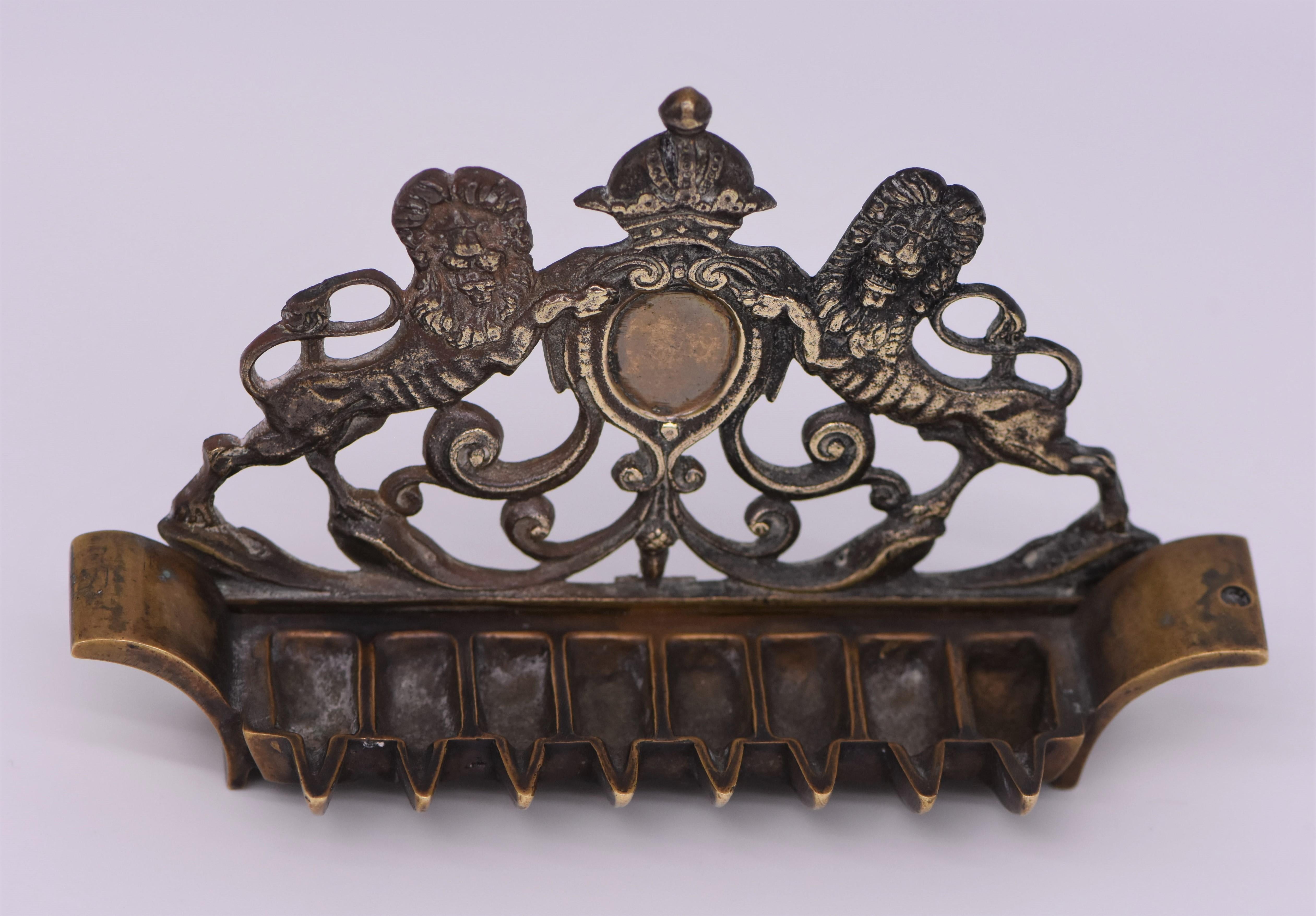 Cast brass Hanukkah lamp, Poland, circa 1860. 
