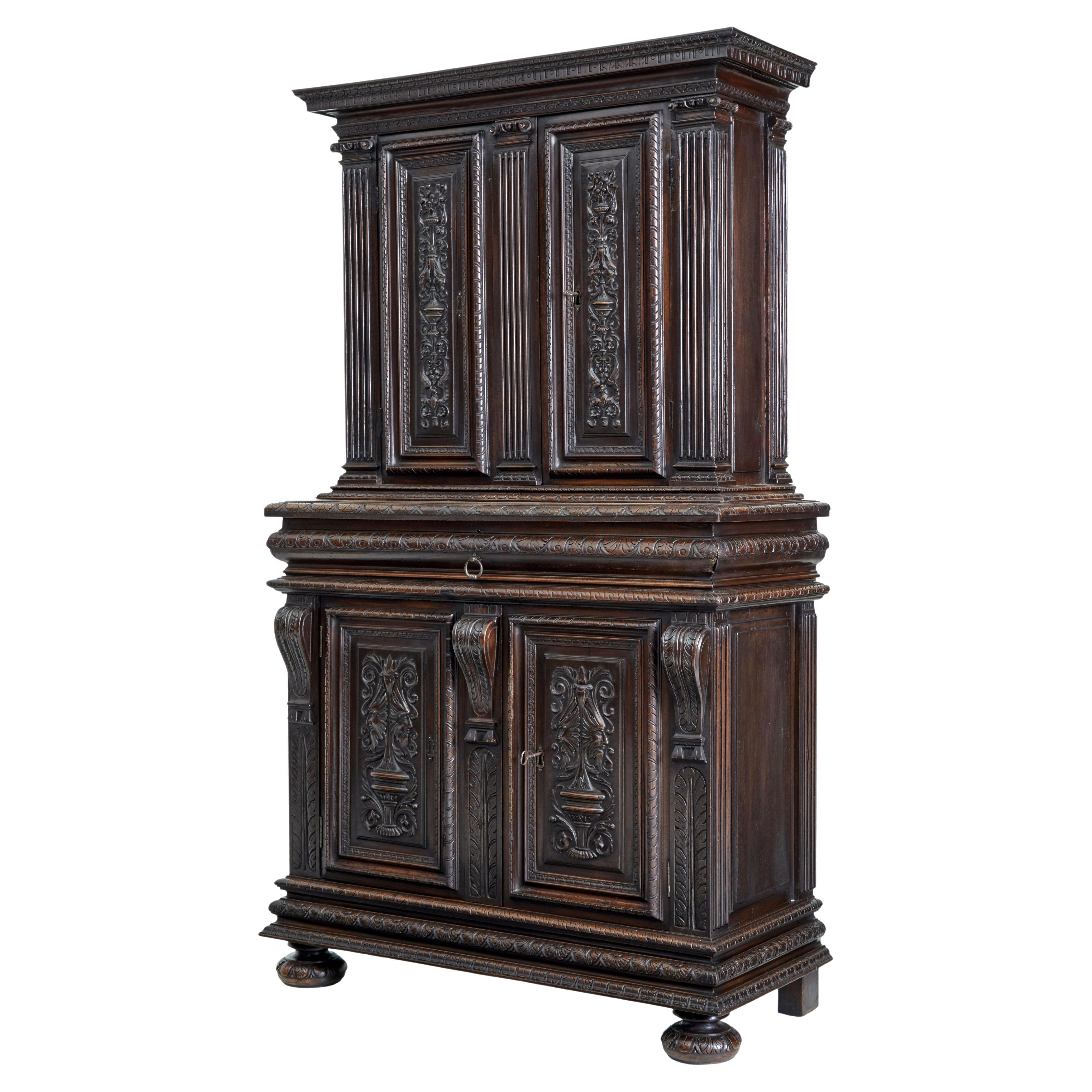 Mid-19th century profusely carved French walnut cabinet For Sale