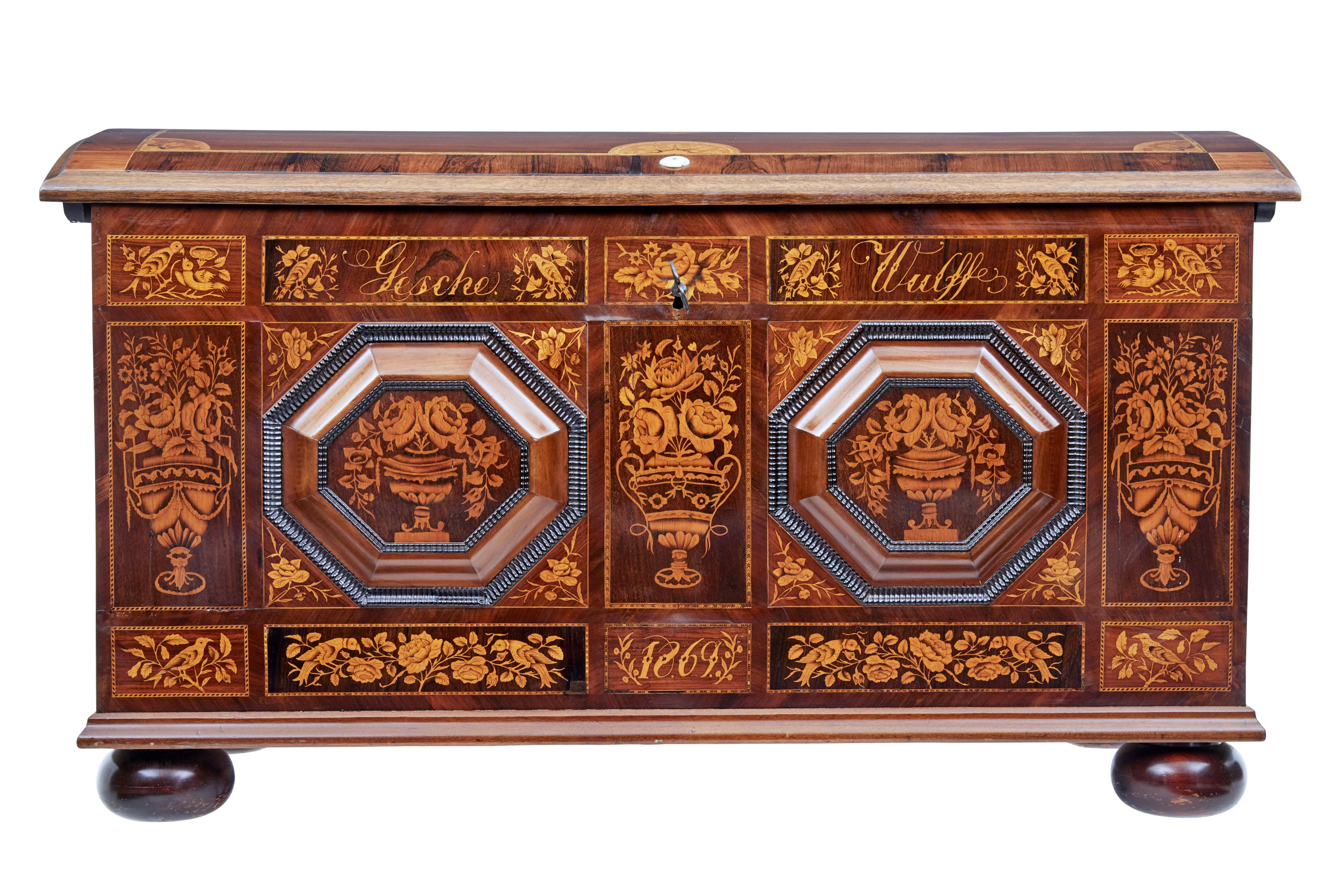 Beautiful inlaid dome top chest of the finest quality, circa 1869.

Inscribed on the front with the name 'gesche wulff' and dated 1869. Superbly inlaid in satinwood with urns, florals and birds. 2 octagonal raised plaques applied to the front,