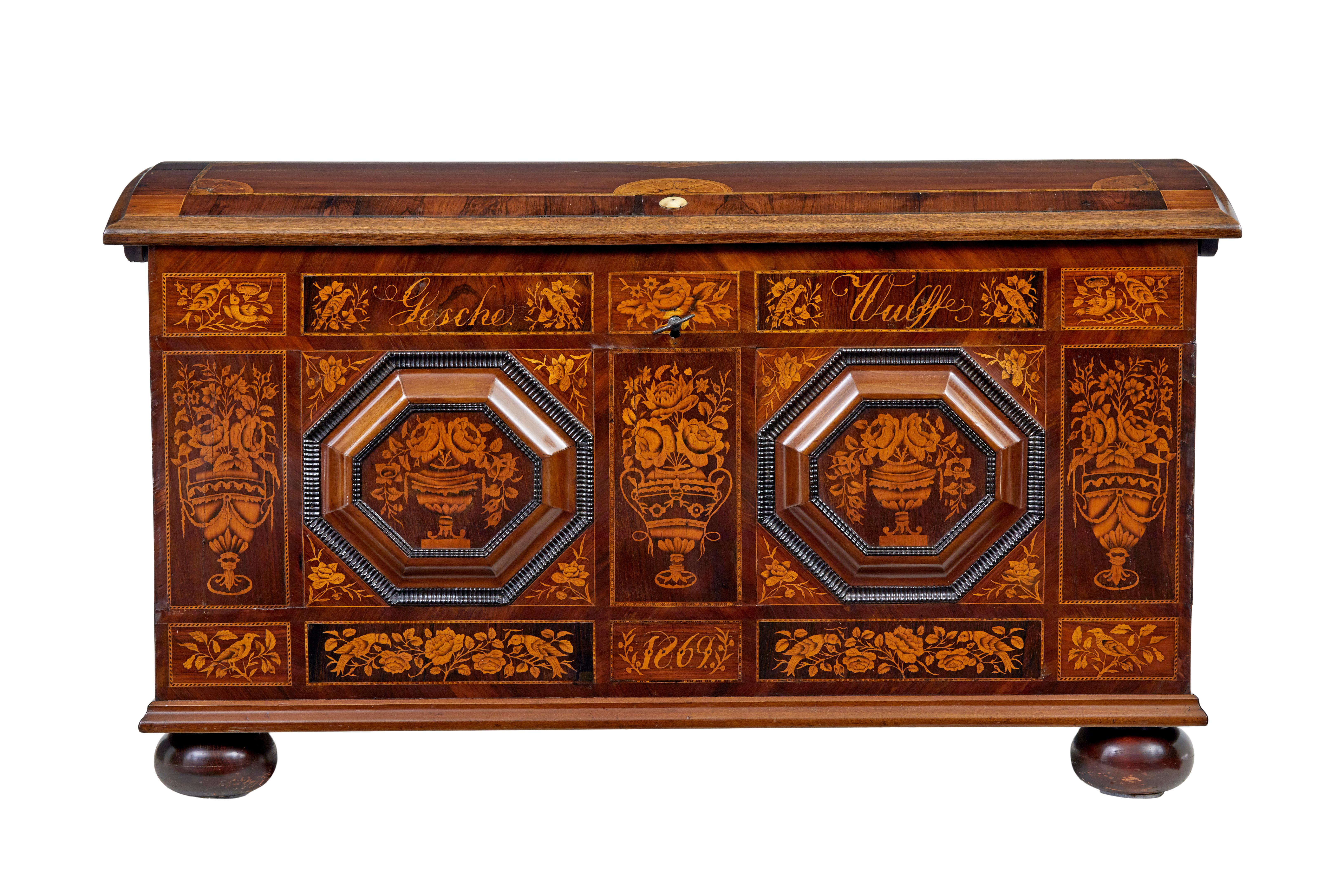 Beautiful inlaid dome top chest of the finest quality circa 1869.

Inscribed on the front with the name 'gesche wulff' and dated 1869.  Superbly inlaid in satinwood with urns, florals and birds.  2 octagonal raised plaques applied to the front,