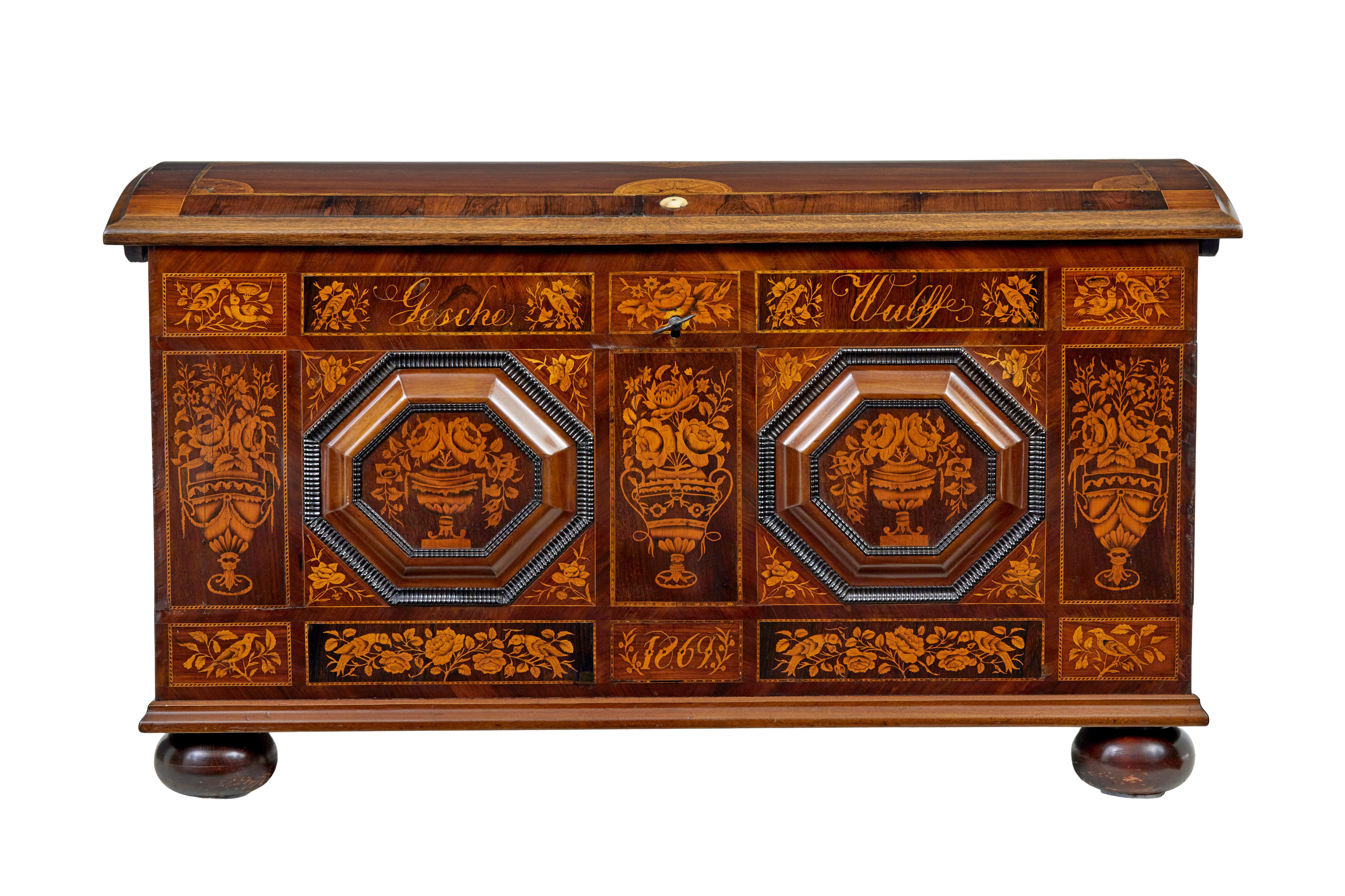 Beautiful inlaid dome top chest of the finest quality circa 1869.

Inscribed on the front with the name 'gesche wulff' and dated 1869.  Superbly inlaid in satinwood with urns, florals and birds.  2 octagonal raised plaques applied to the front,