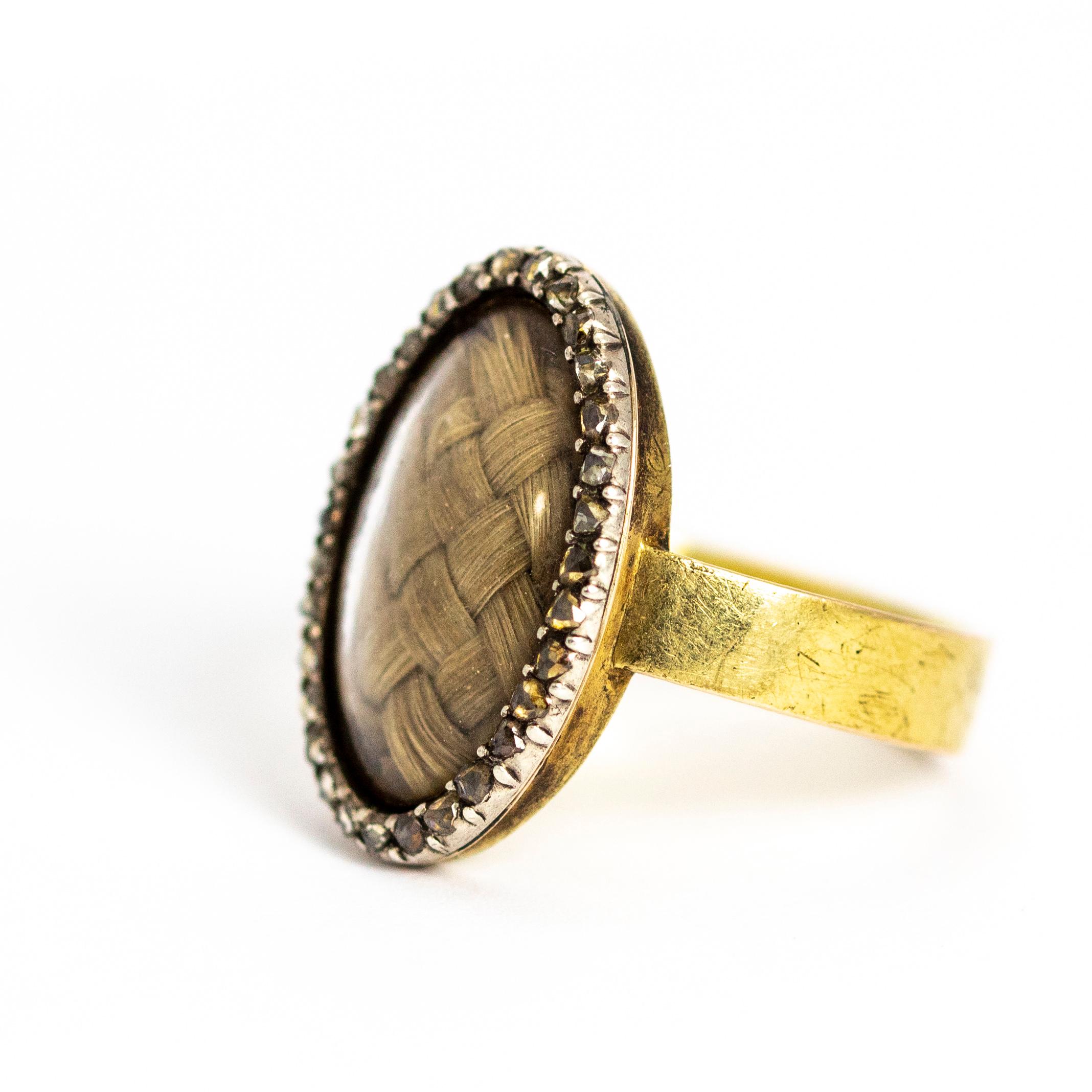 This early victorian mourning ring holds a blonde and perfectly neat plait surrounded by tiny glistening rose cut diamonds. All set in 15ct gold.

Ring Size: O or 7 1/4