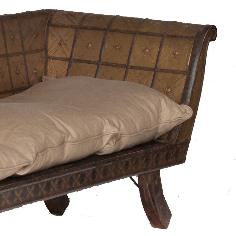 Mid-19th century rustic Moroccan rustic sofa with metal details. Replaced with outside cushion.