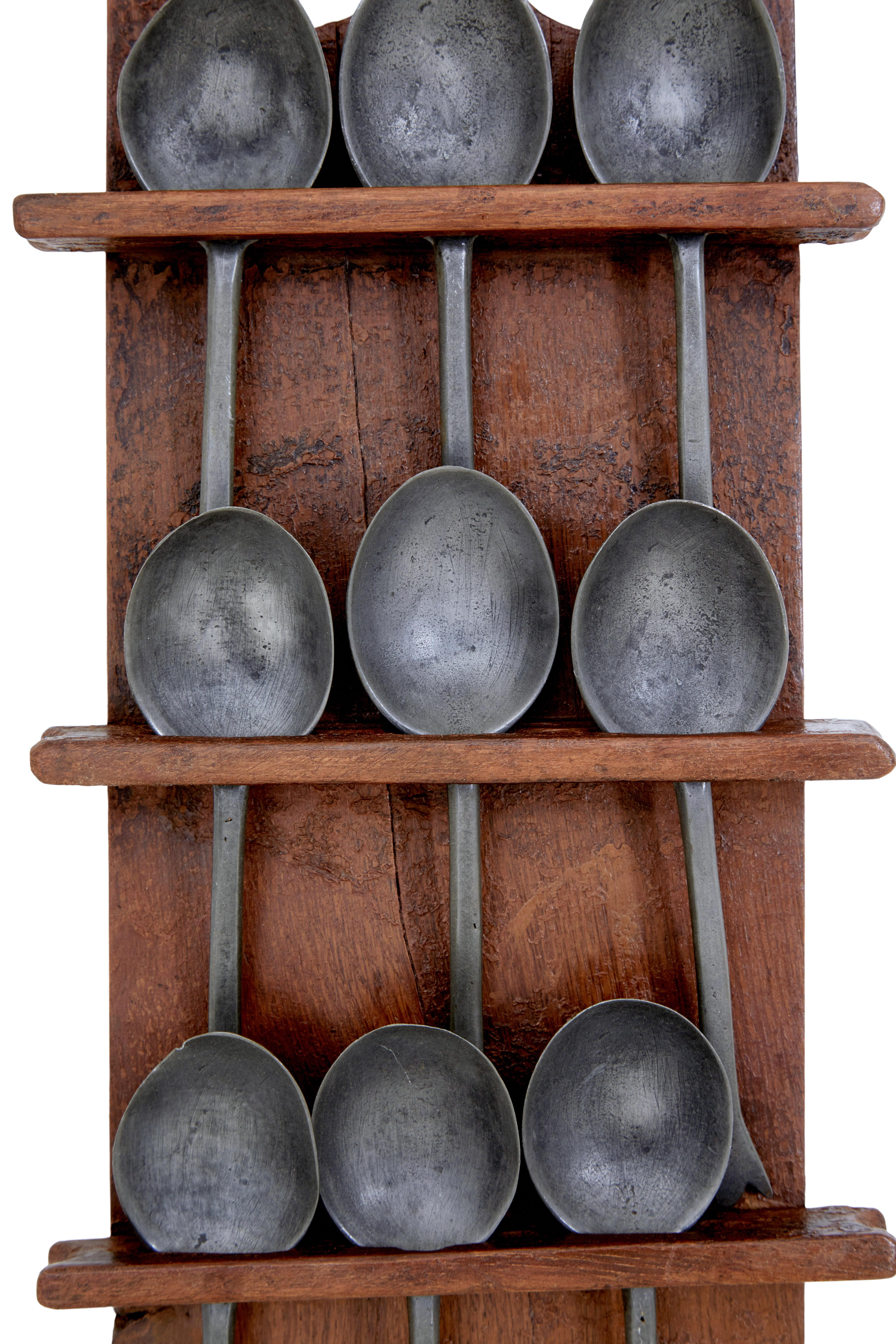 Mid 19th century rustic Swedish hand painted spoon rack circa 1850.

Rustic made spoon rack, hand painted with original paint. Supplied with the original 9 spoons.

Minor losses to paintwork.