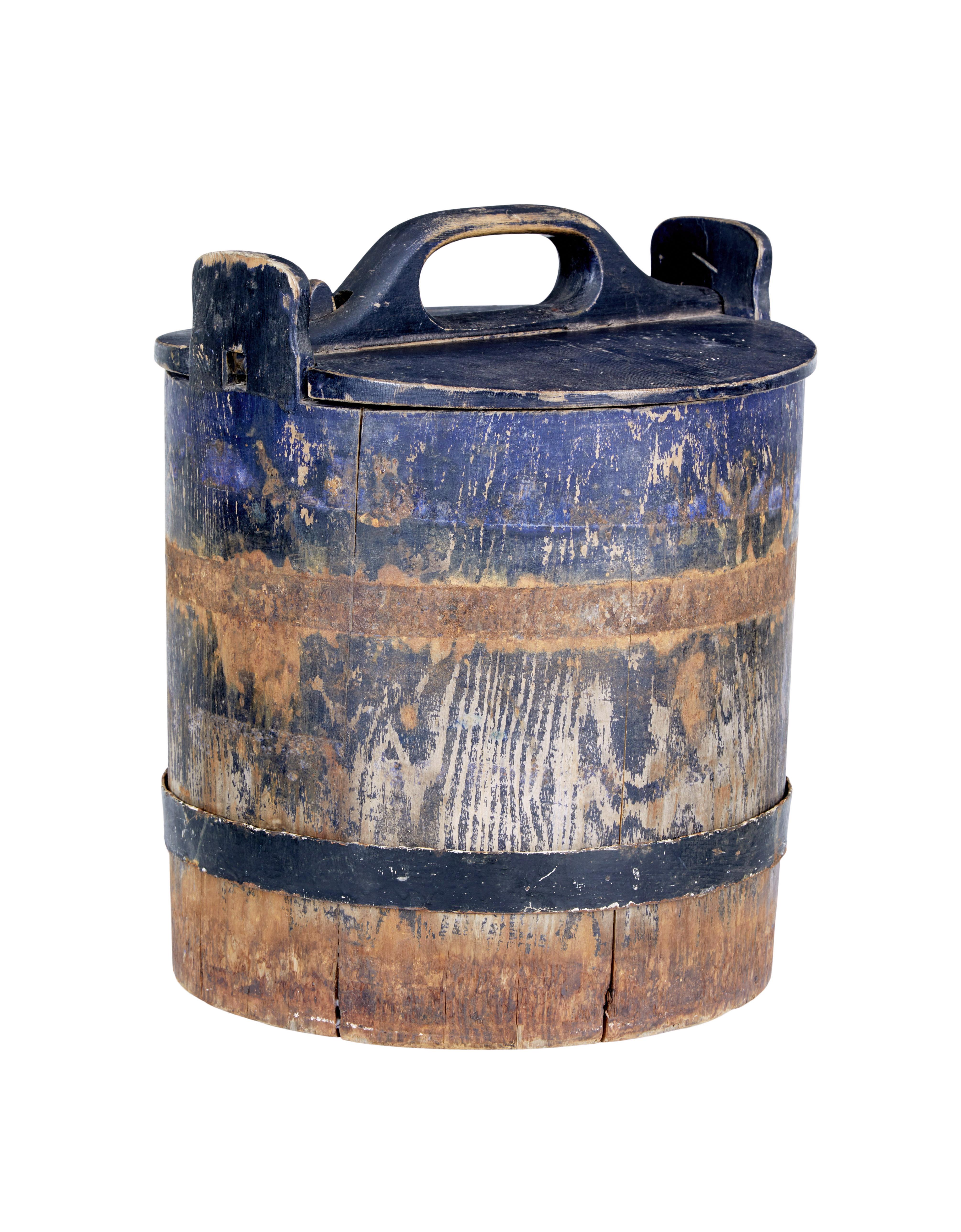 Mid-19th century rustic Swedish pine storage container circa 1860.

Very nice rare item to find intact. Made from pine with original bold blue paint, 1 original metal support hoop the other is no longer present. Lid still present and