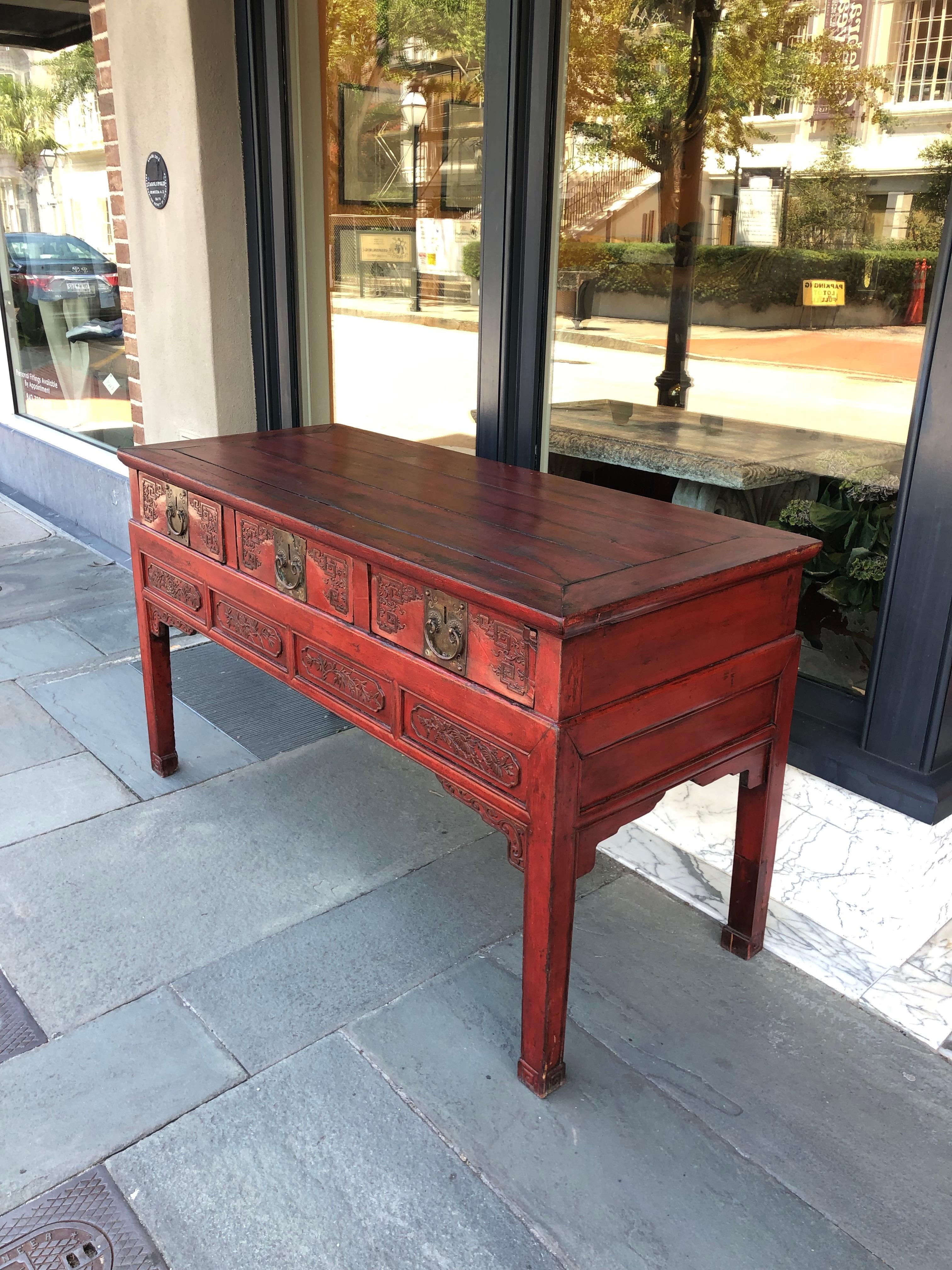 Mid-19th century server or sideboard with 3 drawers and carved details in drawer.