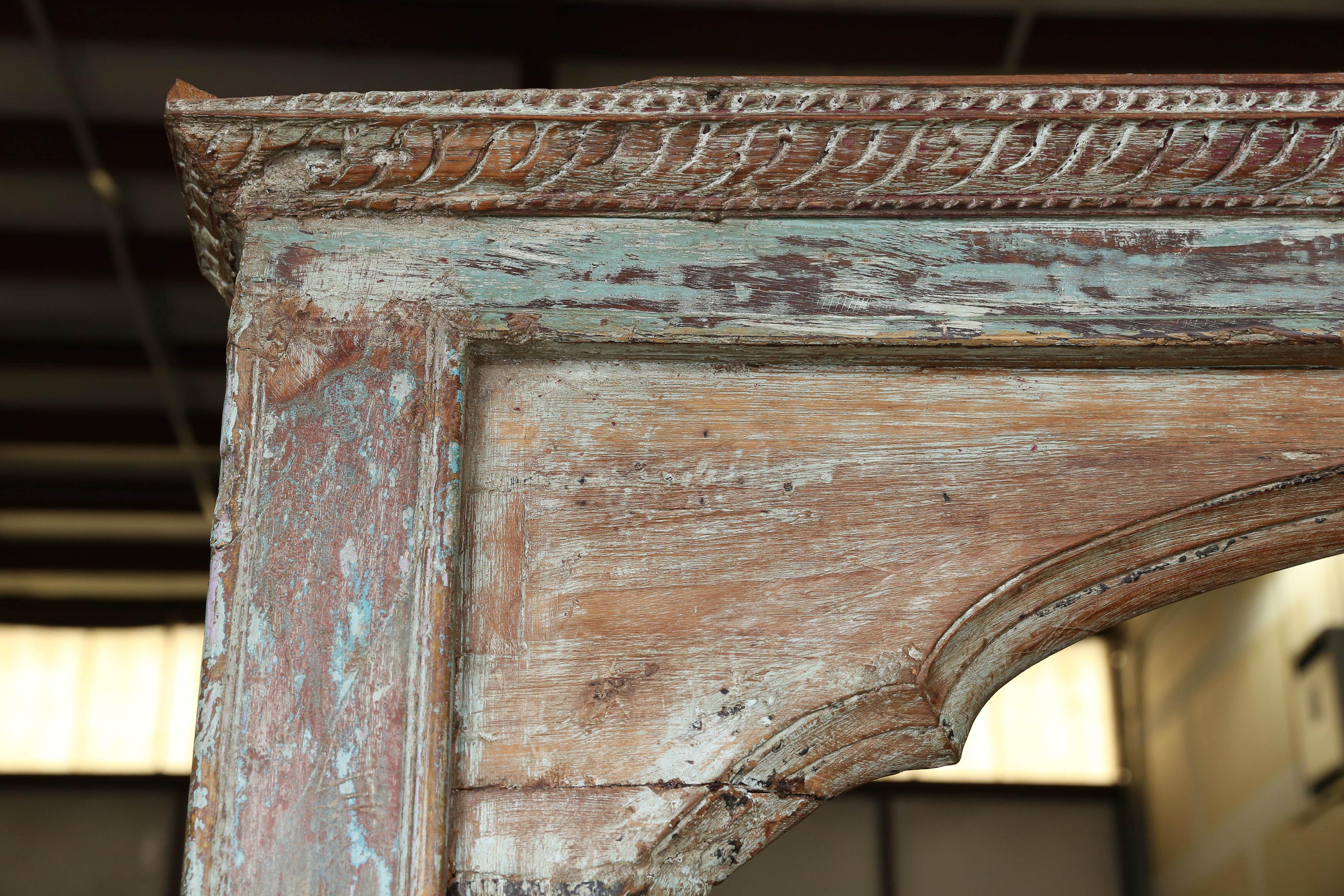 This is an 1850s solid teak wood heavily carved Mughal style window frame. This is a typical Mughal type arch generally used in mosques built in middle eastern countries. This arch which is in an excellent condition comes from a run down castle in