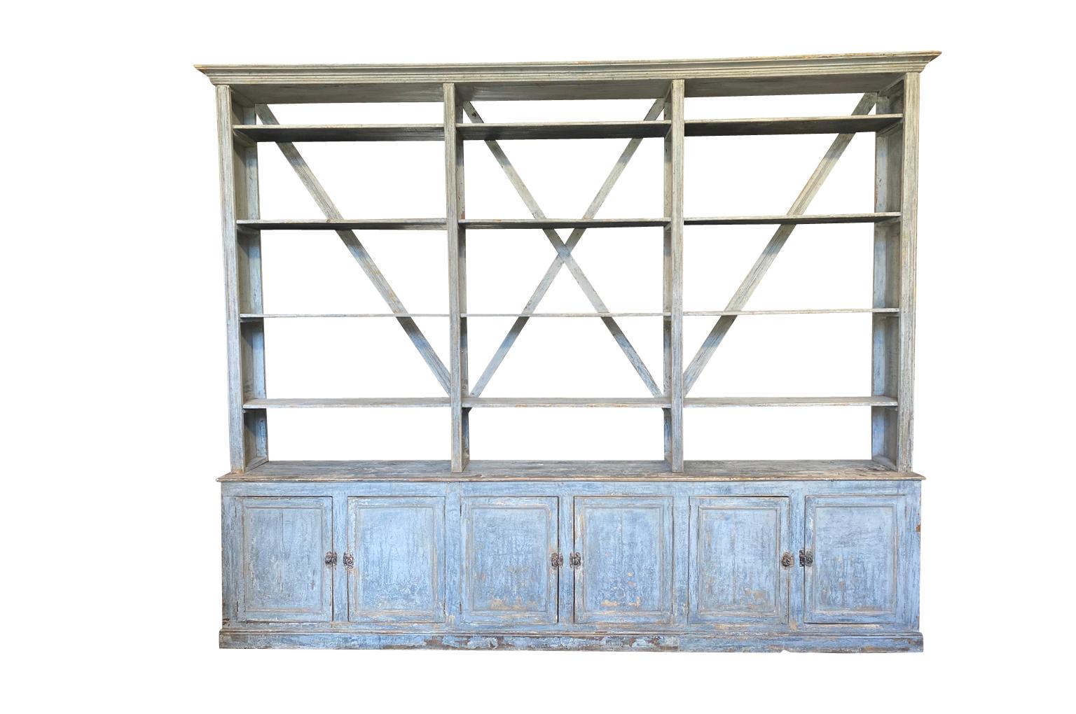 An outstanding mid-19th century bookcase from the Catalan region of Spain. Origining from a shop, this bookcase is soundly constructed from painted wood. Wonderful display and storage.