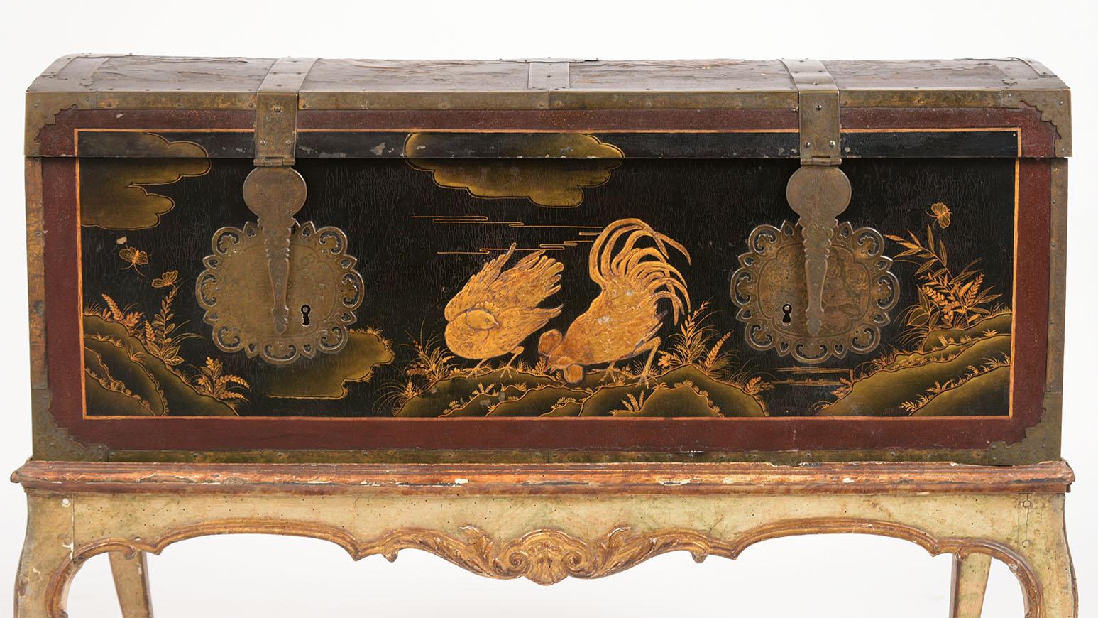 Rare Mid-19th century Spanish chinoiserie Trunk is in good condition and features the original hand carved scenes depicting pheasants and roosters on the top, front, and sides. The trunk has flat brass molding hinges and large key-plates all with