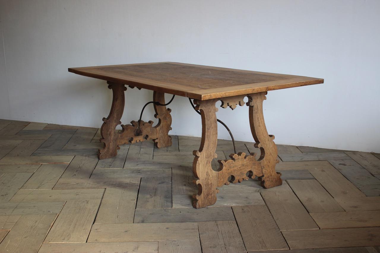 A very charming and with good proportions, mid-19th century Spanish bleached walnut table, with cast iron stretcher in the 17th century taste, that will work well as a centre table, dining table or a desk.
Measures: 71cm (Knee height).