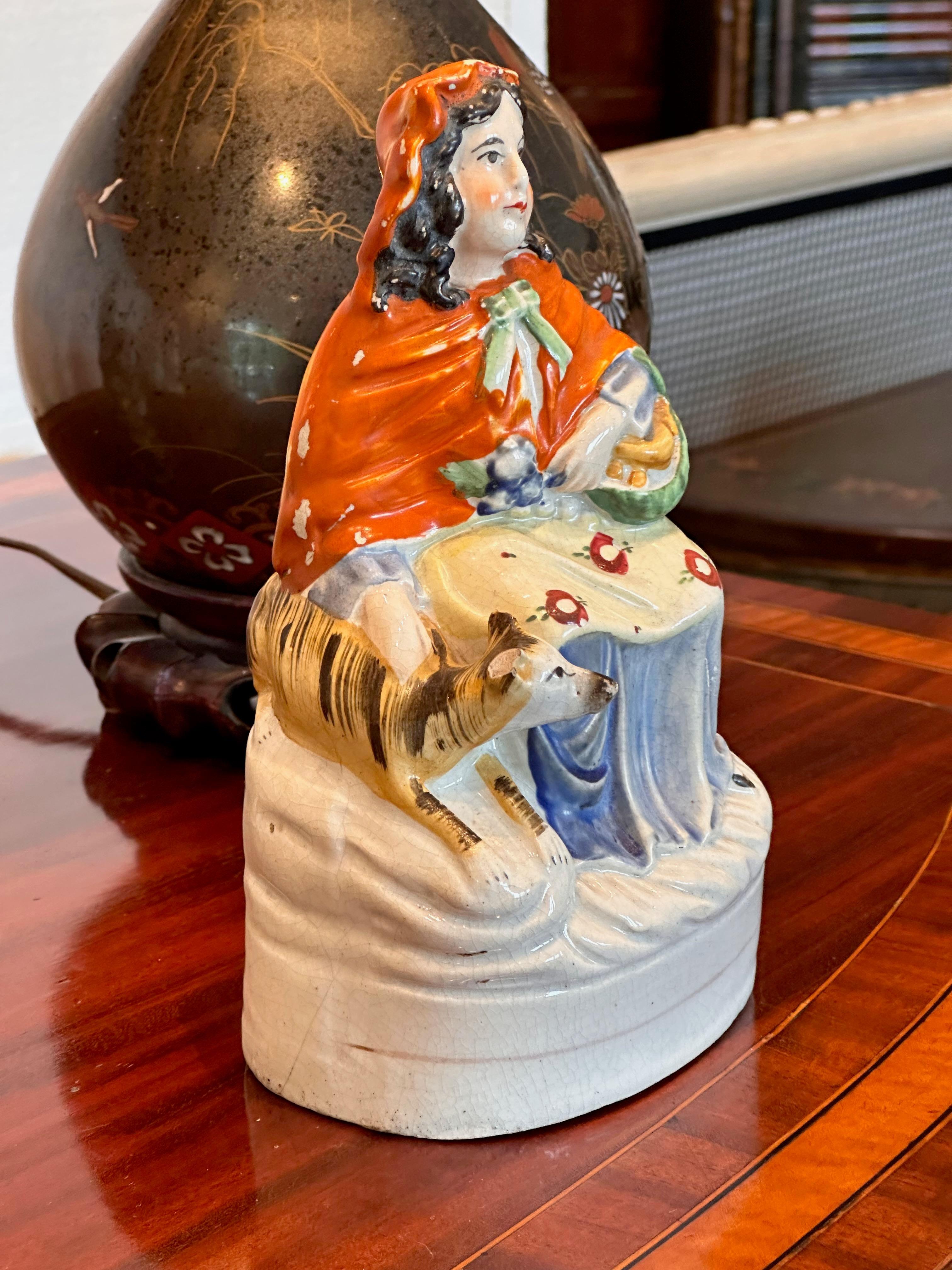 Mid 19th Century Staffordshire Woman With Dog Figurine In Good Condition For Sale In Charlottesville, VA