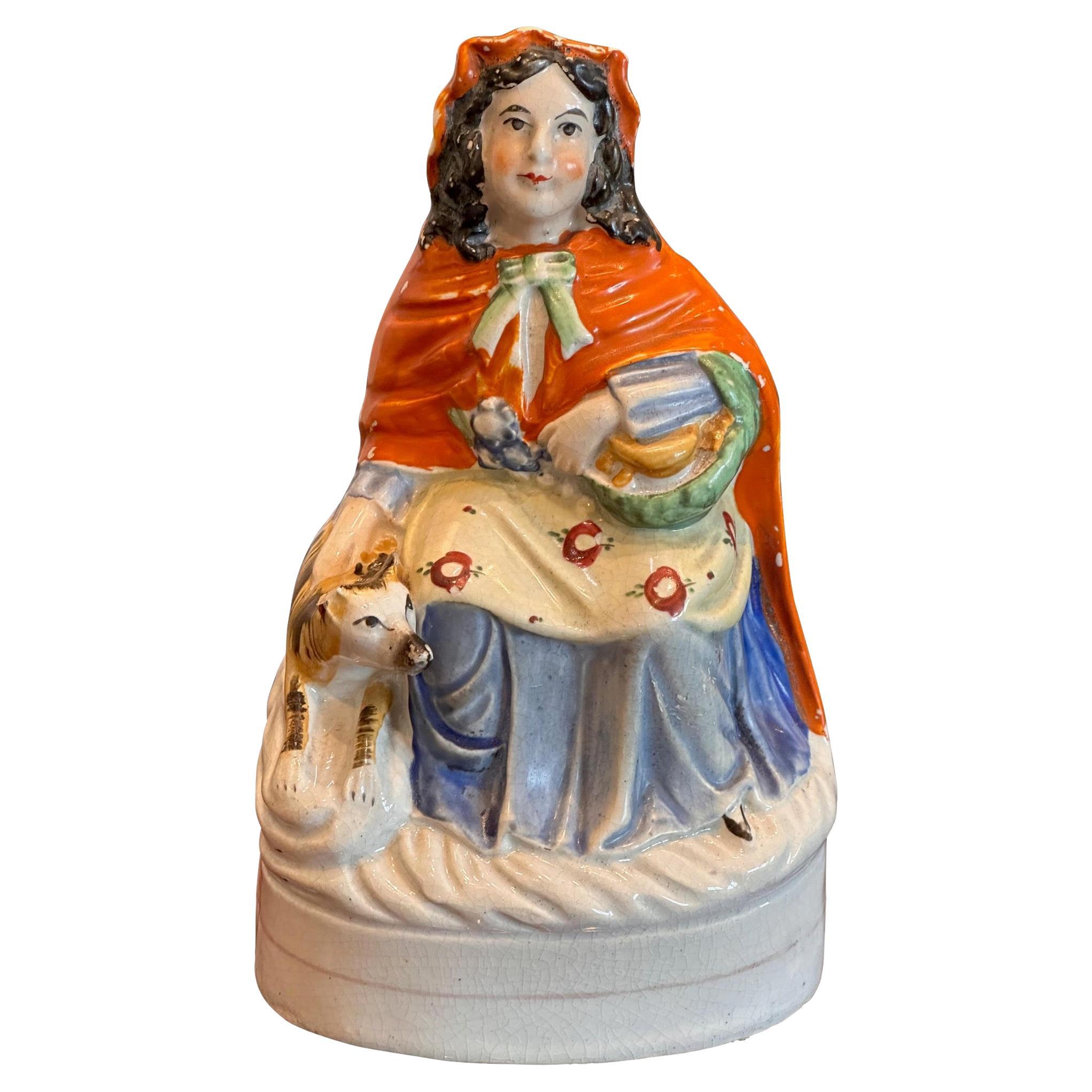 Mid 19th Century Staffordshire Woman With Dog Figurine For Sale