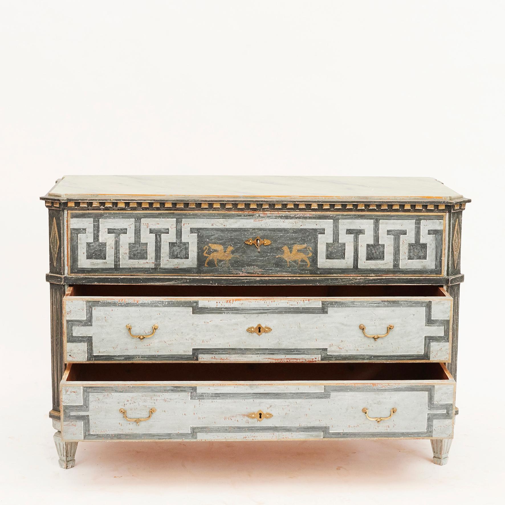 Chest of drawers, Gustavian style. Painted in blue shades. Tabletop blue-gray marbled. 3 drawers. Upper drawer with 'à la grecque' motif.
Sweden, 1840-1860. Very decorative.