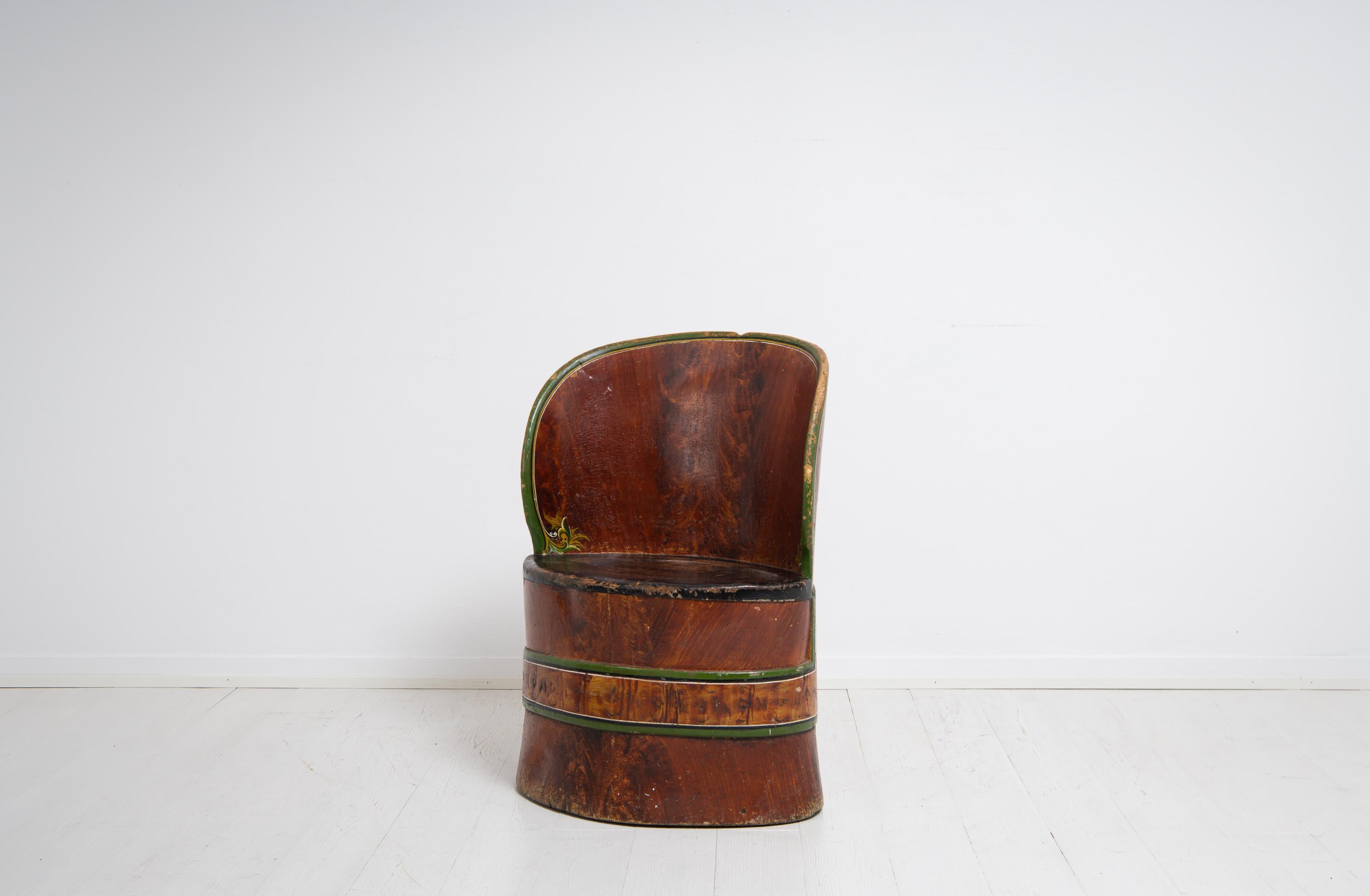 Swedish folk art stump chair made during the mid 1800s. The stump chair is a primitive chair made from an hollowed tree stump and this one has paint from the 1800s. It has some marks of distress and wear after use but is in otherwise good condition.