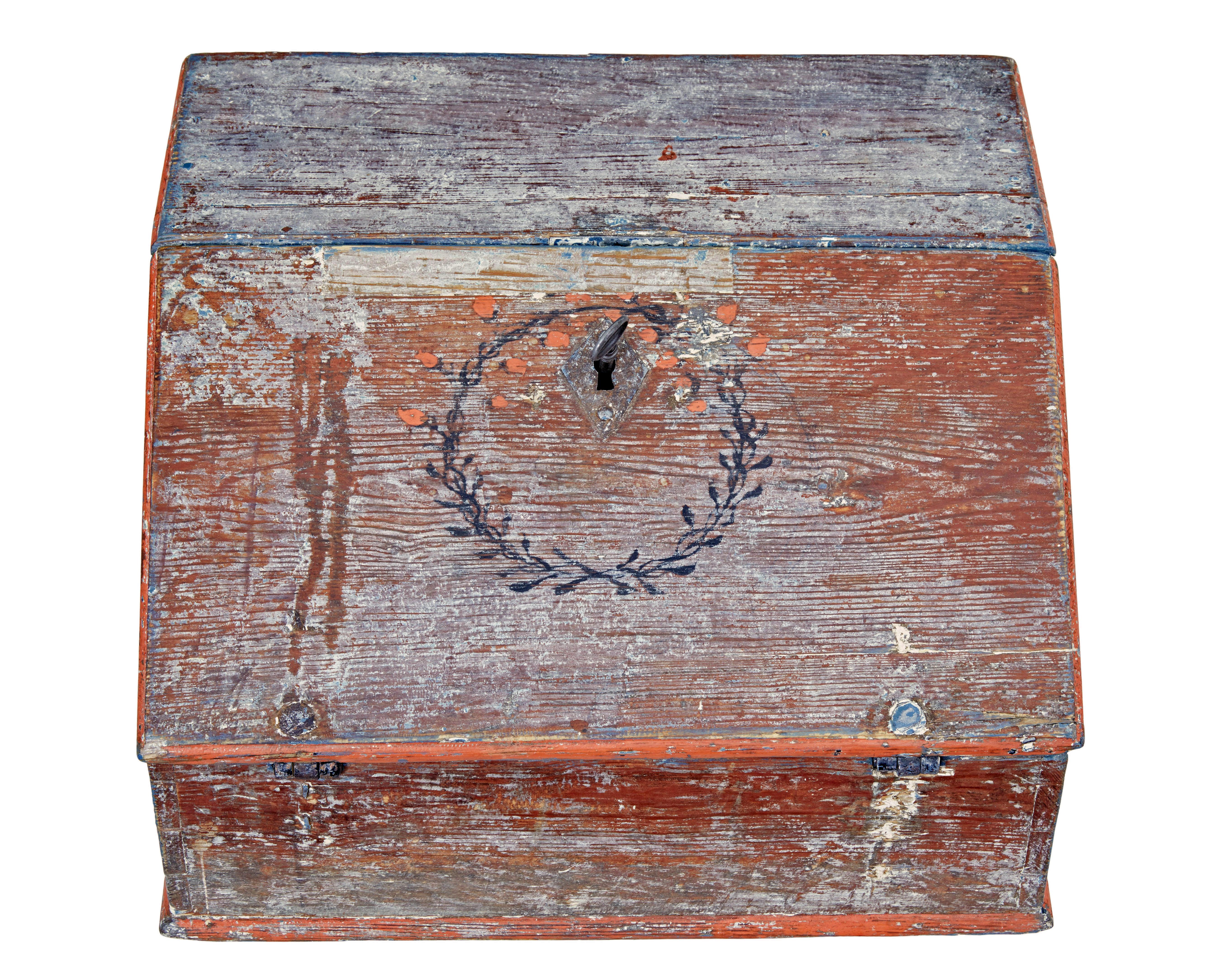 Mid 19th century Swedish painted table top writing desk circa 1850.

Good quality table top bureau, presented in original scraped back paint.  Made from solid pine and scraped back to its original red base paint, black wreath around the keyhole is a