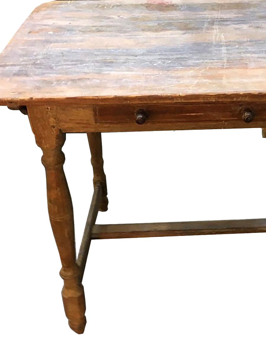 This mid-19th century Scandinavian Rococo table features decoratively carved wooden legs and a single drawer with two handles. The piece has a beautiful patina and would be perfect as a side or occasional table.
 