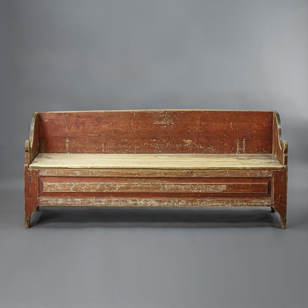 Swedish trundle sofa or settle, dry scraped back to its original distressed painted surface. Wonderful soft edges.

      
