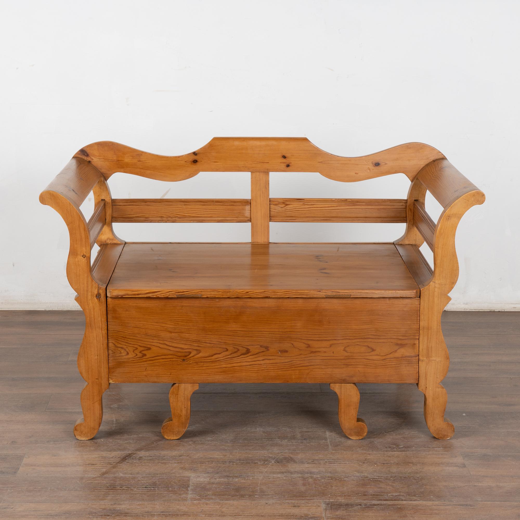 The years of use have deepened the warm patina of the pine in this delightful small scale bench. This size is unusual and difficult to find, making it a special addition to one's home.
Notice the seat is removable, creating great storage space for