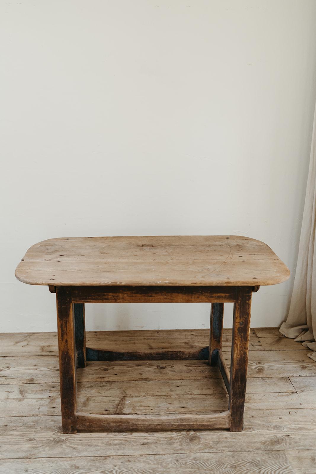 rests of old blue paint on the base of this Swedish pinewood kitchen table ... 