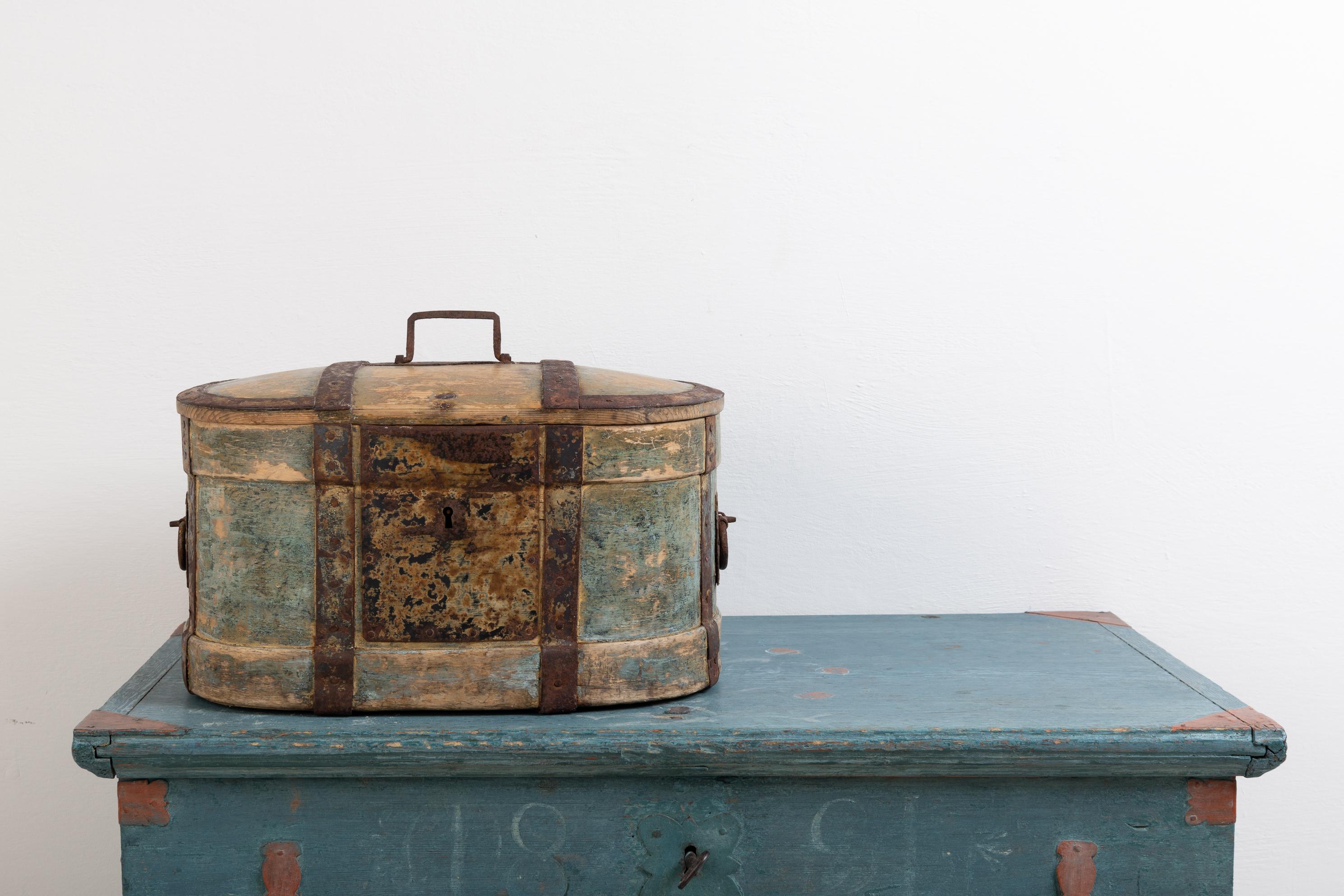 Mid-19th century Folk Art travel box. The box has a painted date and monogram on the inside of the lid. Dated 1864. Decorated and strengthened with handwrought iron around the box and over the lid. The box was used to store valuables during travels.