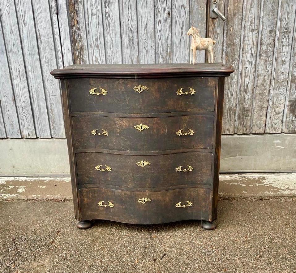 Mid-19th Century chest of drawers painted in black. This classic Gustavian commode or dresser is a very versatile piece that works well in a foyer, living room or bedroom. 