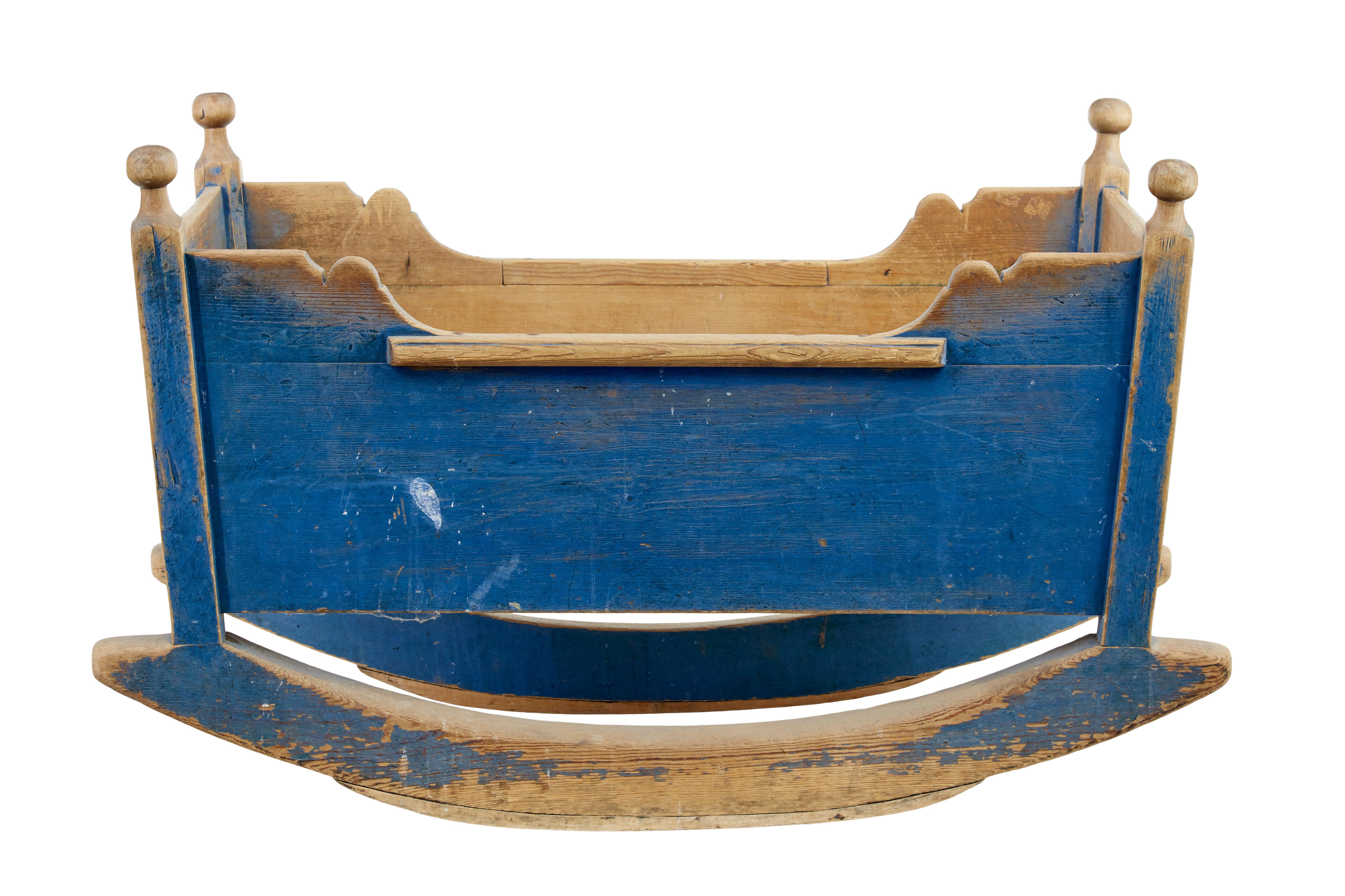 Original condition traditional Swedish rocking cradle circa 1860.

Painted in traditional blue colours with personalised inscribed with 2 births with initials from 1852 and 1855.   Rare piece painted in original colours, turned finials in pine.

A