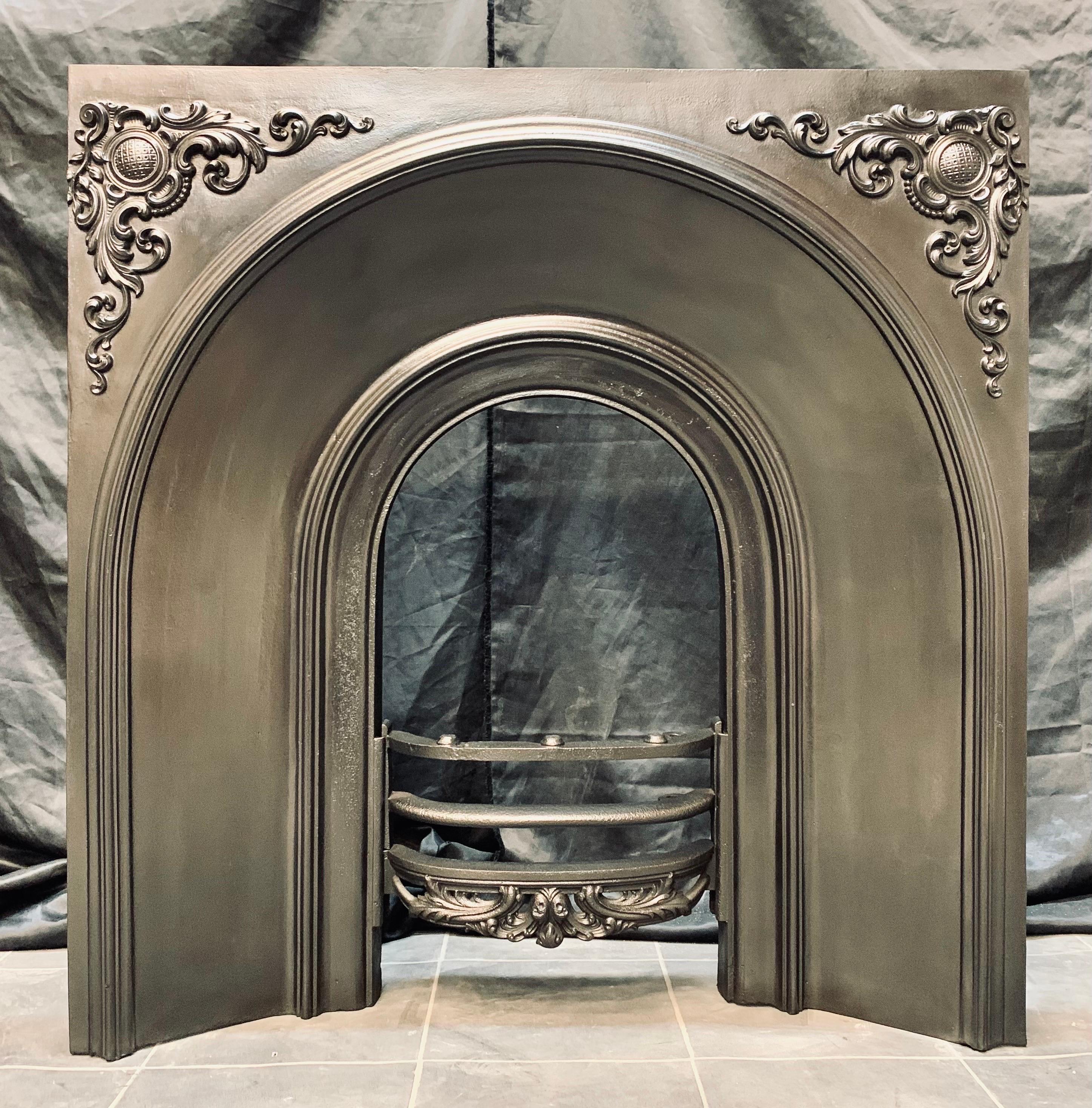 A charming mid 19th Century Victorian cast iron fireplace insert. A generous outer plate with high relief corner embellishments, a three barred shaped fire front. The casting stamp to the rear tells us this was cast in 1849. 

The internal fire