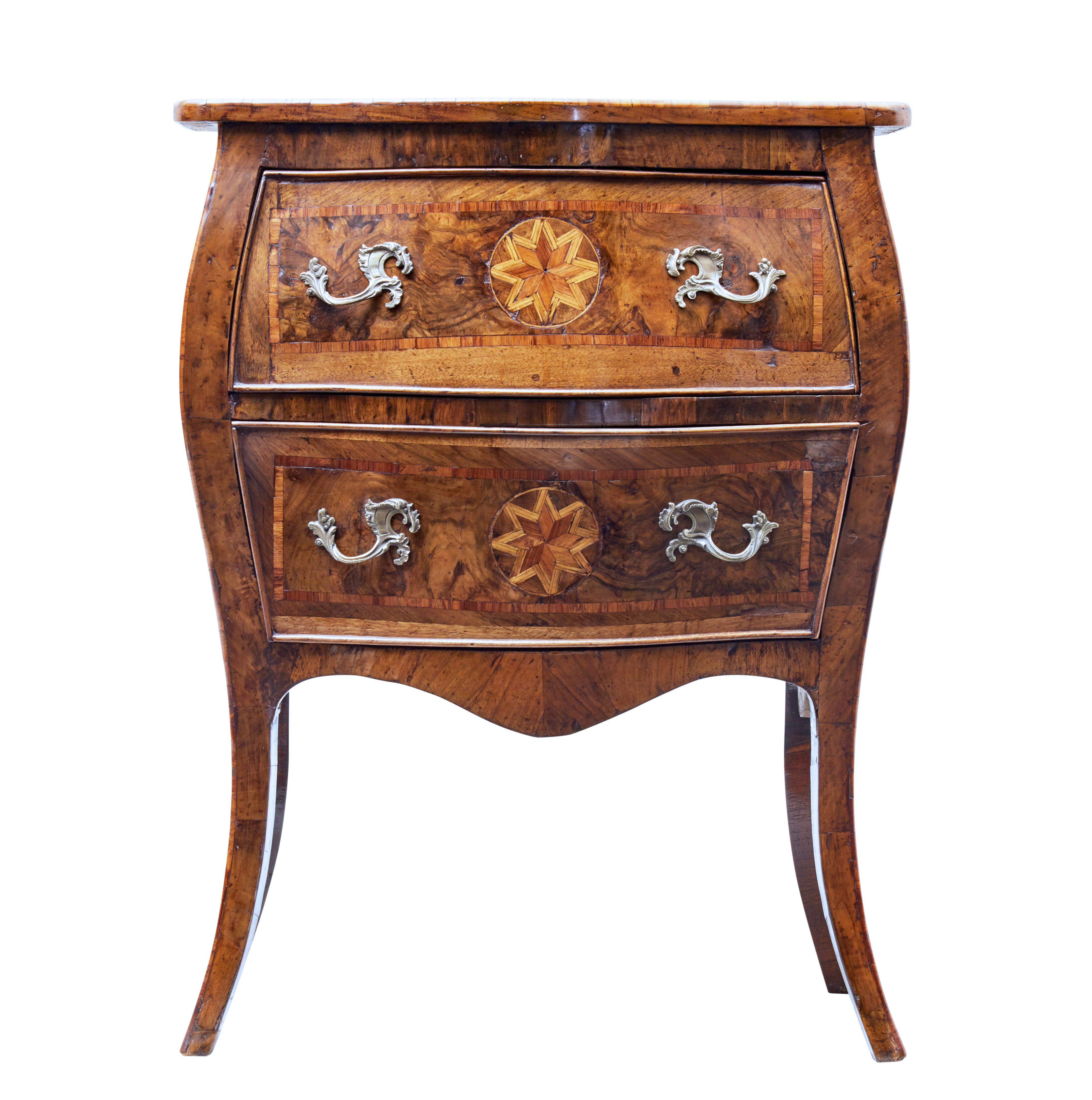Mid-19th century walnut inlaid Maltese commode, circa 1850.

Delightful Maltese inlaid commode of small proportions.

Inlaid and crossbanded with various exotic woods. Star motif to the top surface, drawer fronts and sides. 2 deep drawers with