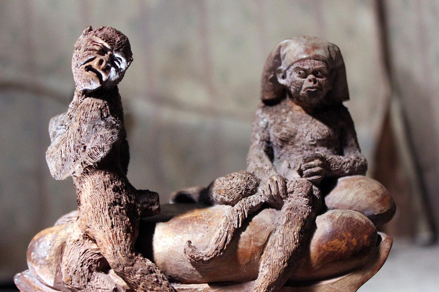 The interesting and amusing mid-19th century French terracotta comical animalier group of two monkeys, one seated on a chaise in a pharaoh’s type headdress holding the severed tail of the other figure much to his dismay, on a rounded rectangular