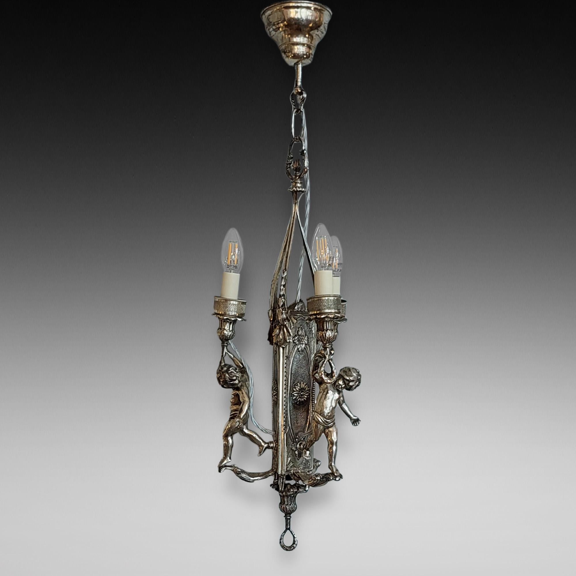 Mid 19thC Silver Plated Ceiling Candle Light Fitting of Three Cherubs Holding Urn Shaped Torches with Adam Style Rosettes - converted to electric - 9