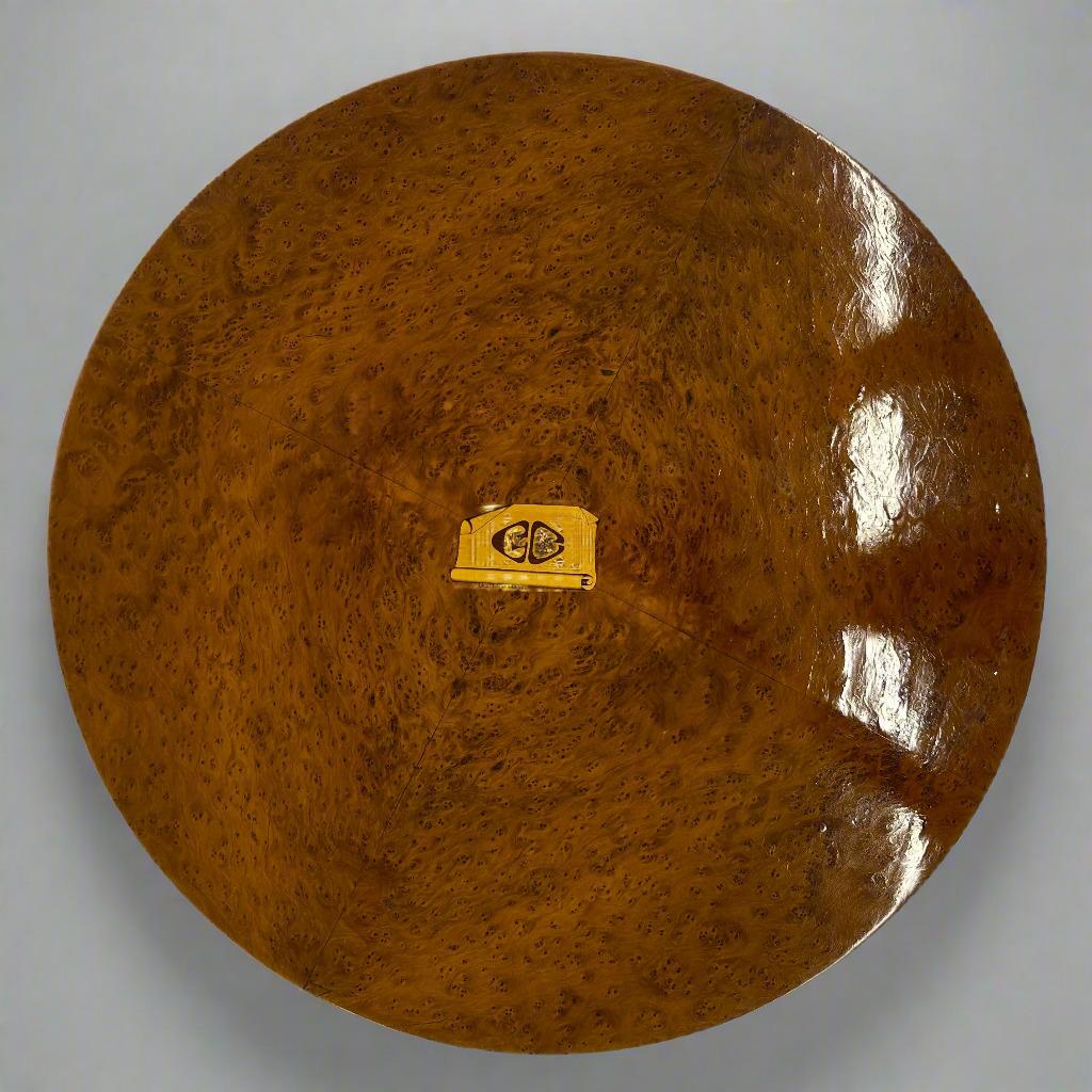 An Italian Art Deco period round side table from Italy circa 1930. Birds eye maple, walnut burl , with fruitwood inlay detail.