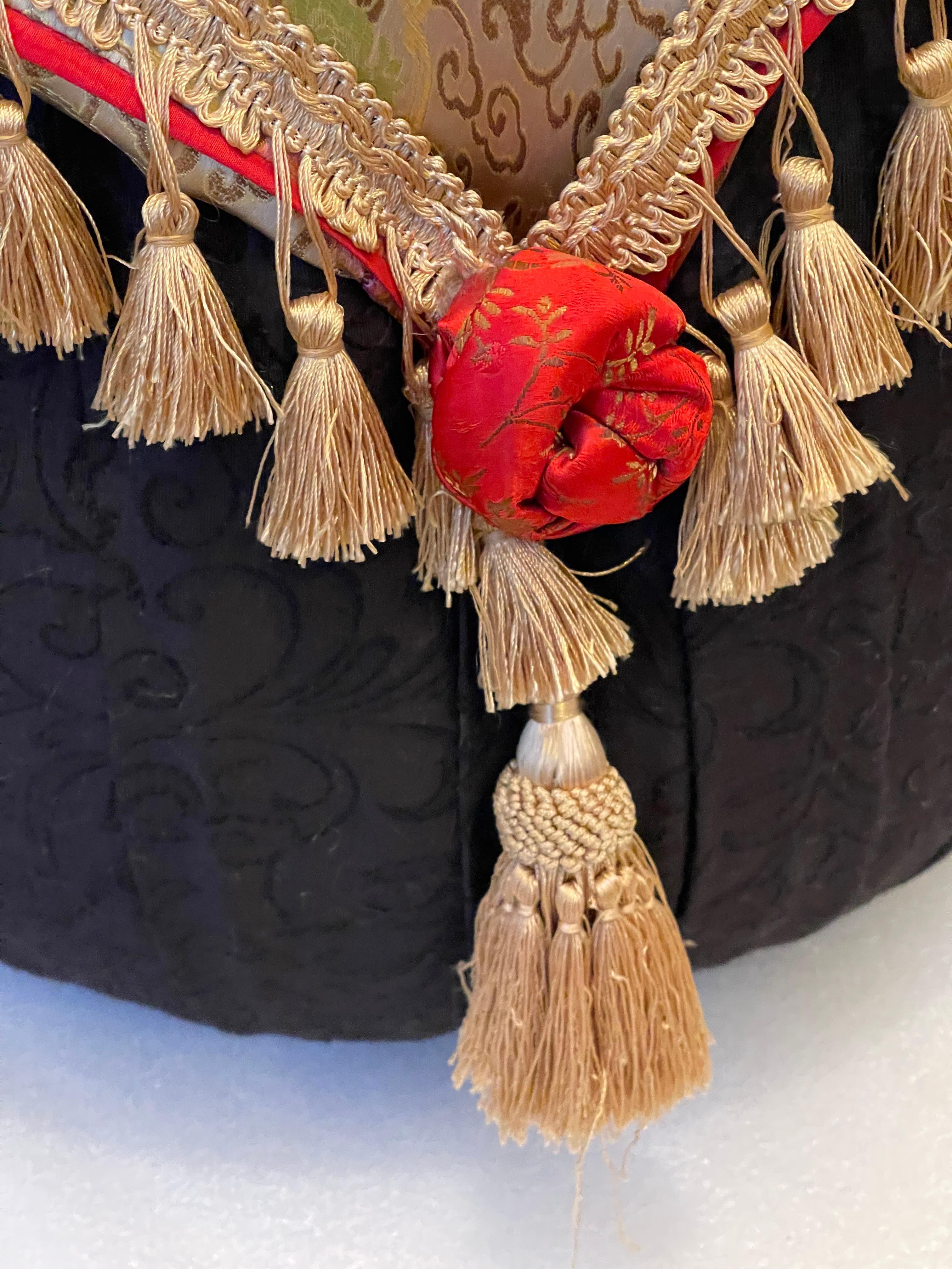 Bernhardt designed mid 20 th c round pouf with silk jaccard textile cover with tassels. 