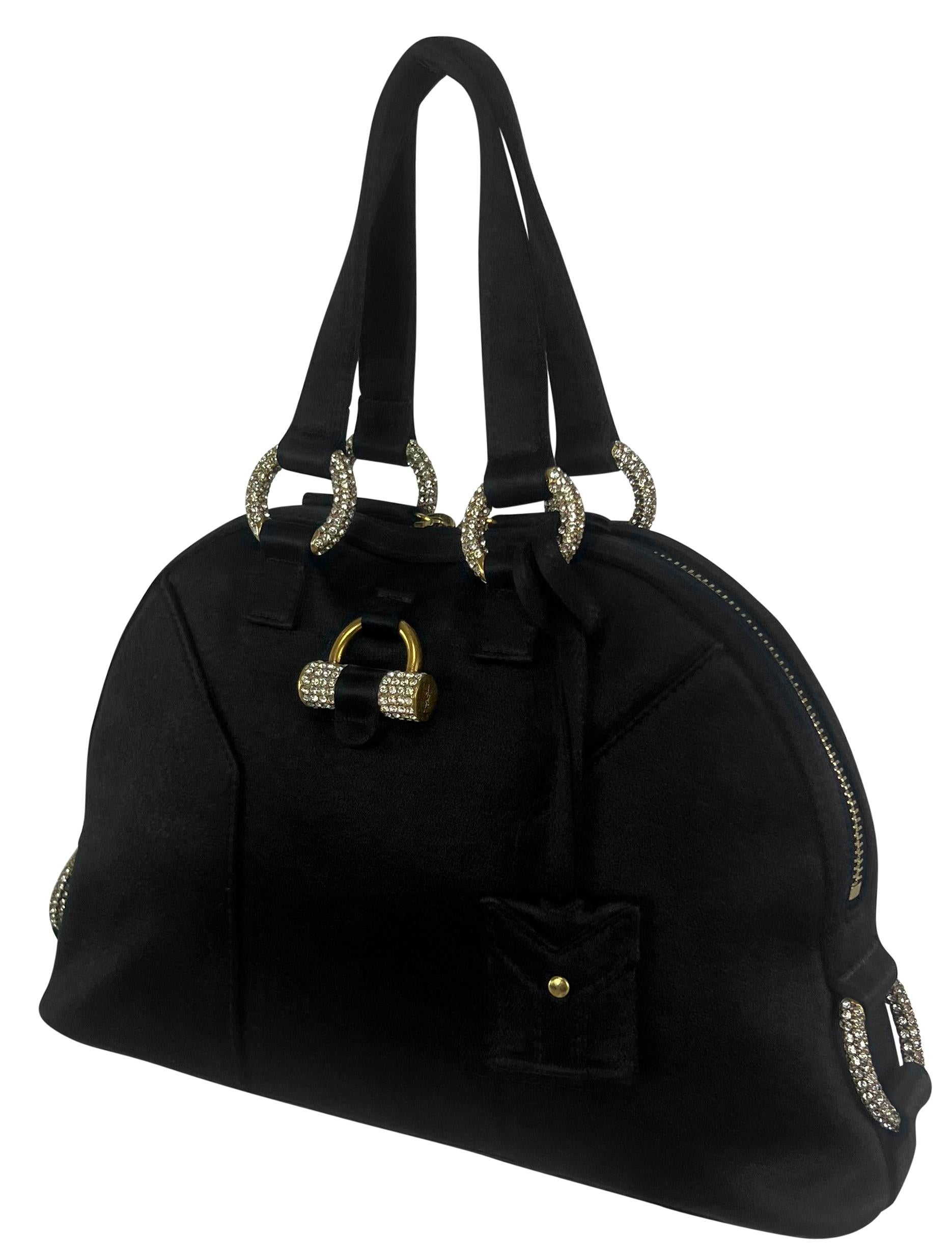 From the mid 2000s, this gorgeous Yves Saint Laurent 'Muse' bag is constructed entirely of black satin. Designed by Stefano Pilati, this petite bag features a dome shape and is complete with gold-tone rhinestone-covered hardware. The perfect mini