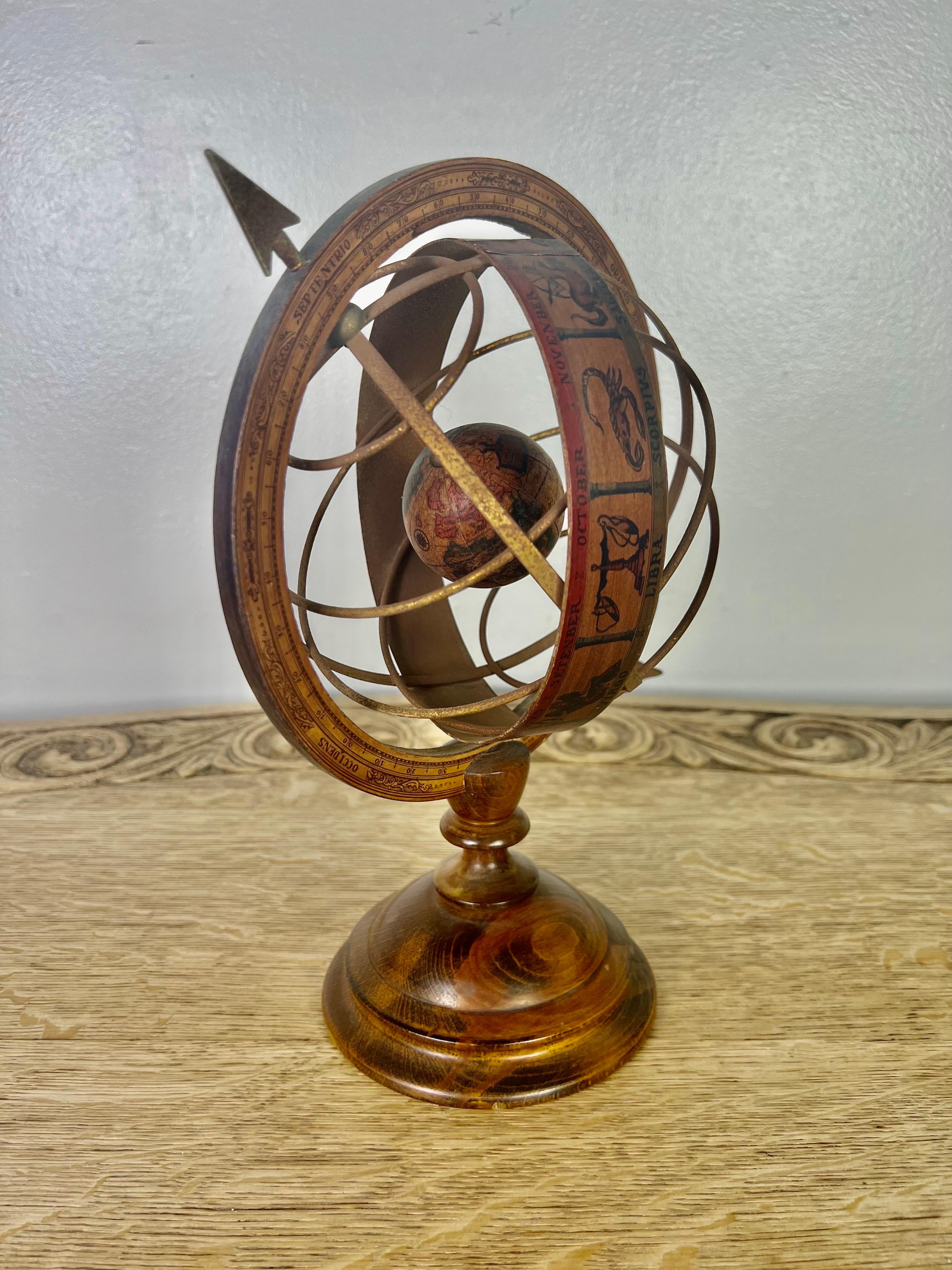 The armillary sphere is usually a ball representing the earth. It is used to demonstrate the motion of the stars consisting of a spherical framework of rings that represent lines of celestial longitude and latitude and other astronomically important