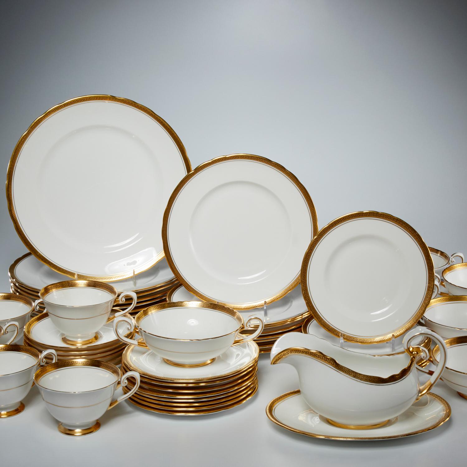 20th c., English, Royal Tuscan for Harrold's of London (52) pieces, white porcelain dinnerware, with gilt rim decorated in gold Greek Key design with hand painted black highlighting. Maker's mark to underside, with Harrod's retailer mark,. Set